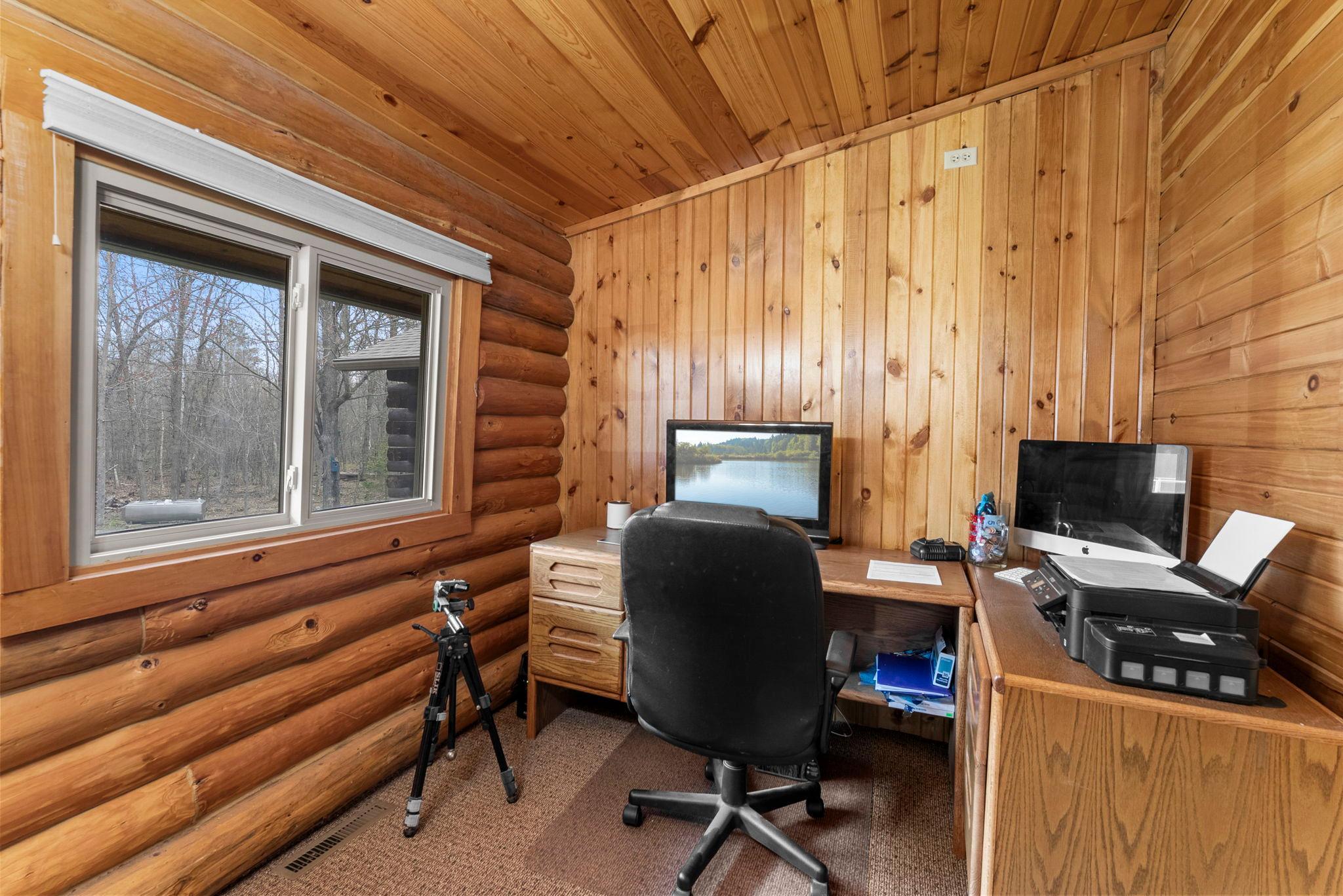 Main floor 3rd bedroom/office. You have to walk through the guest room to get to this room