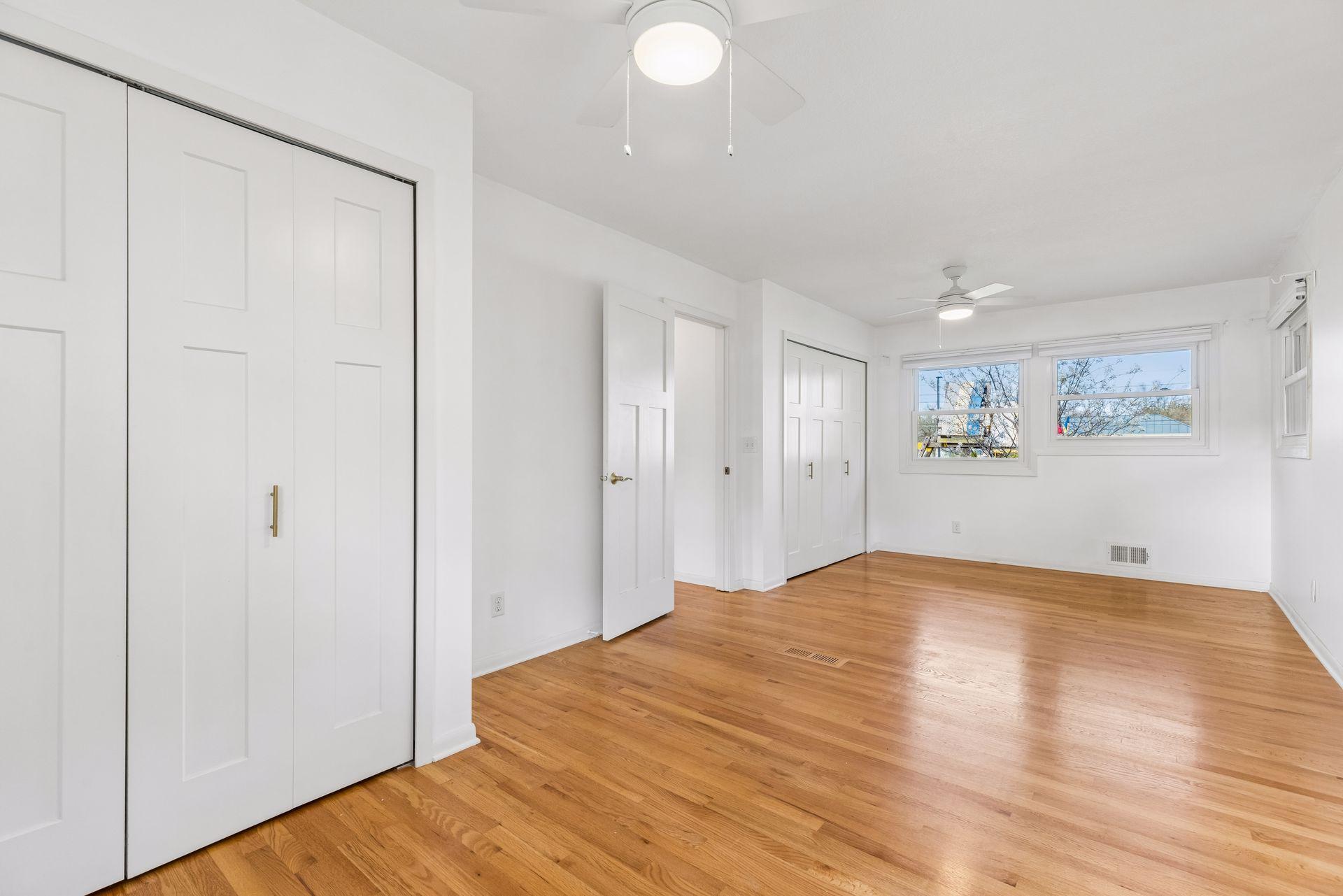 There are two closets in here and 4 windows making it a light and bright space.