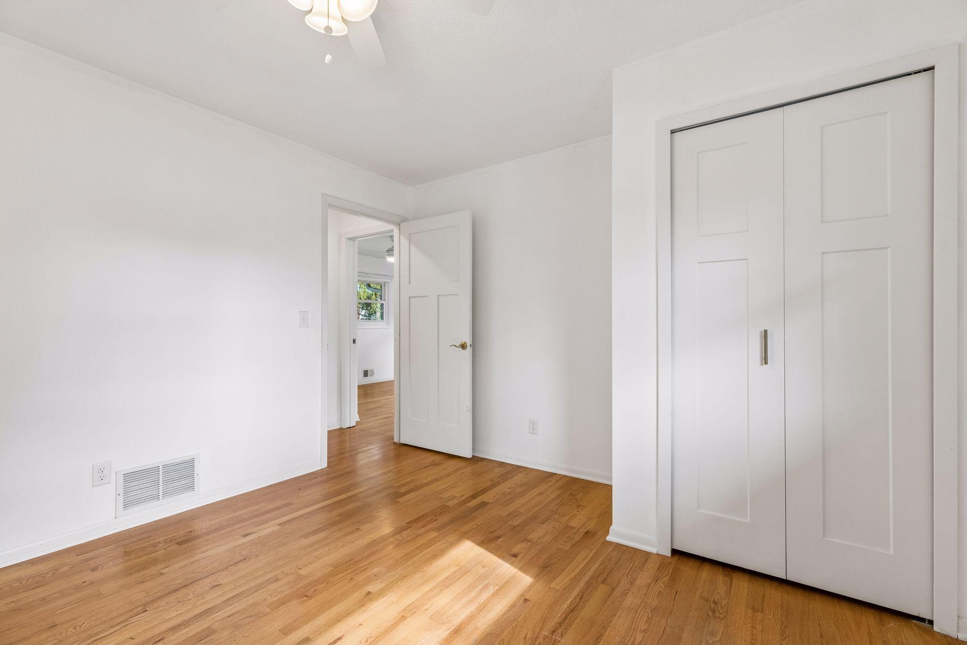 This room also is a good size with a closet and wood floors.