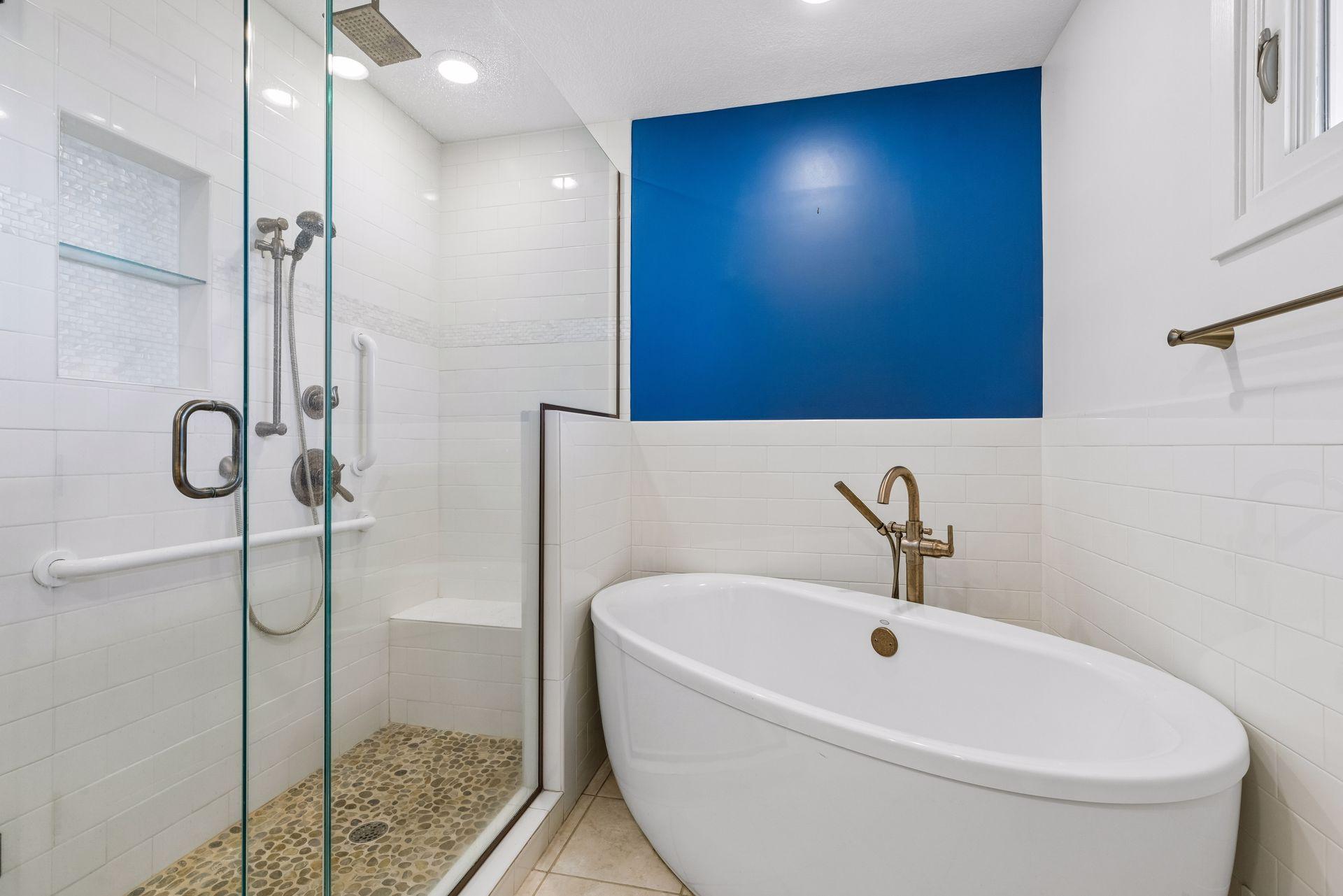 The bathroom also has a separate shower and bathtub.