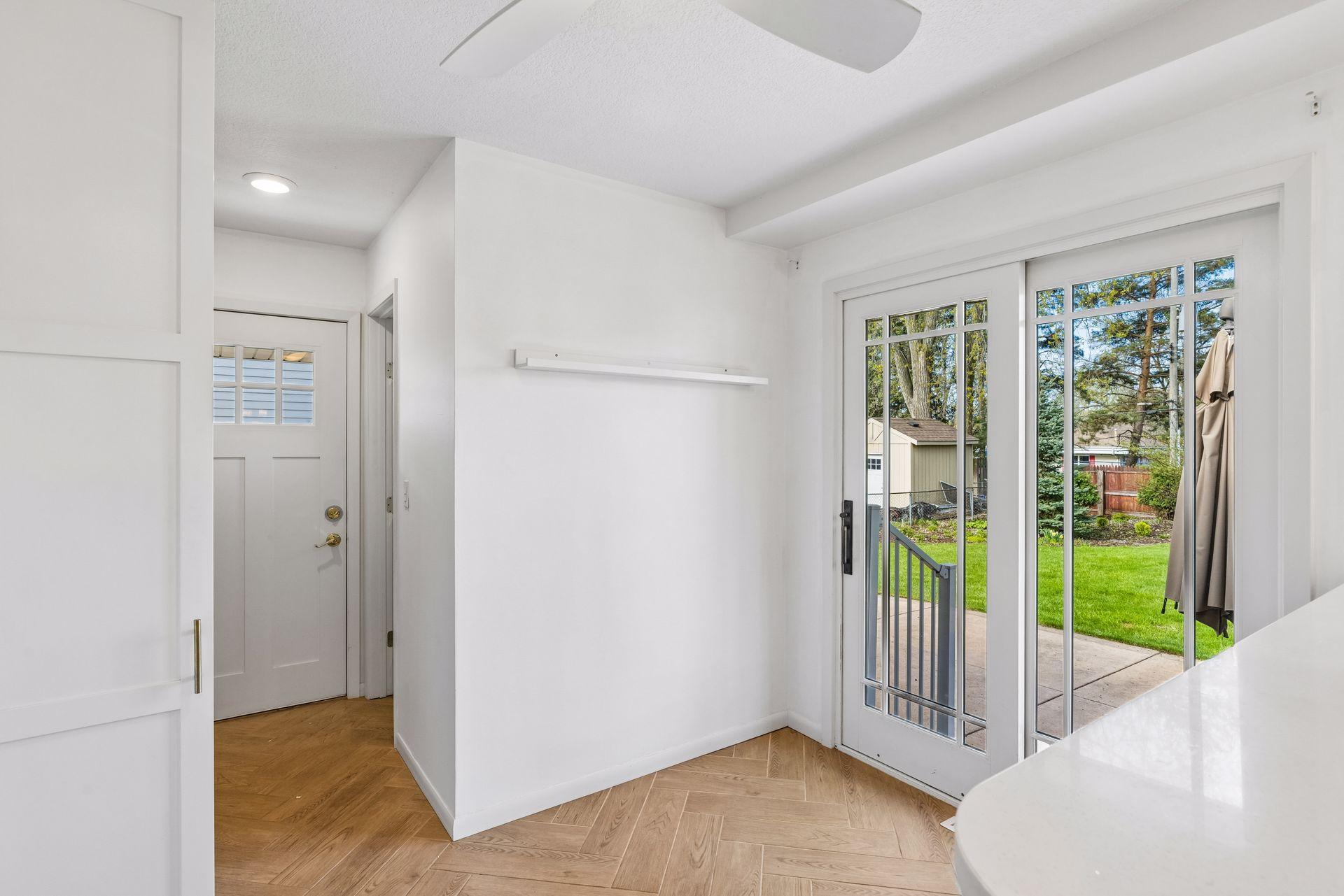 The patio doors here lead out to the backyard.