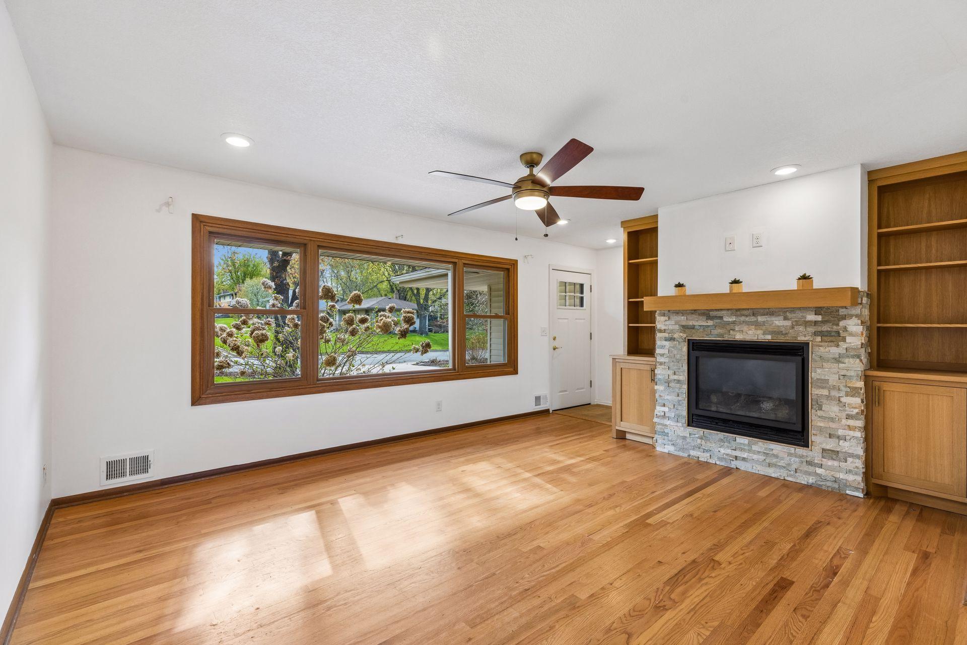 The living room has a large, east facing window.