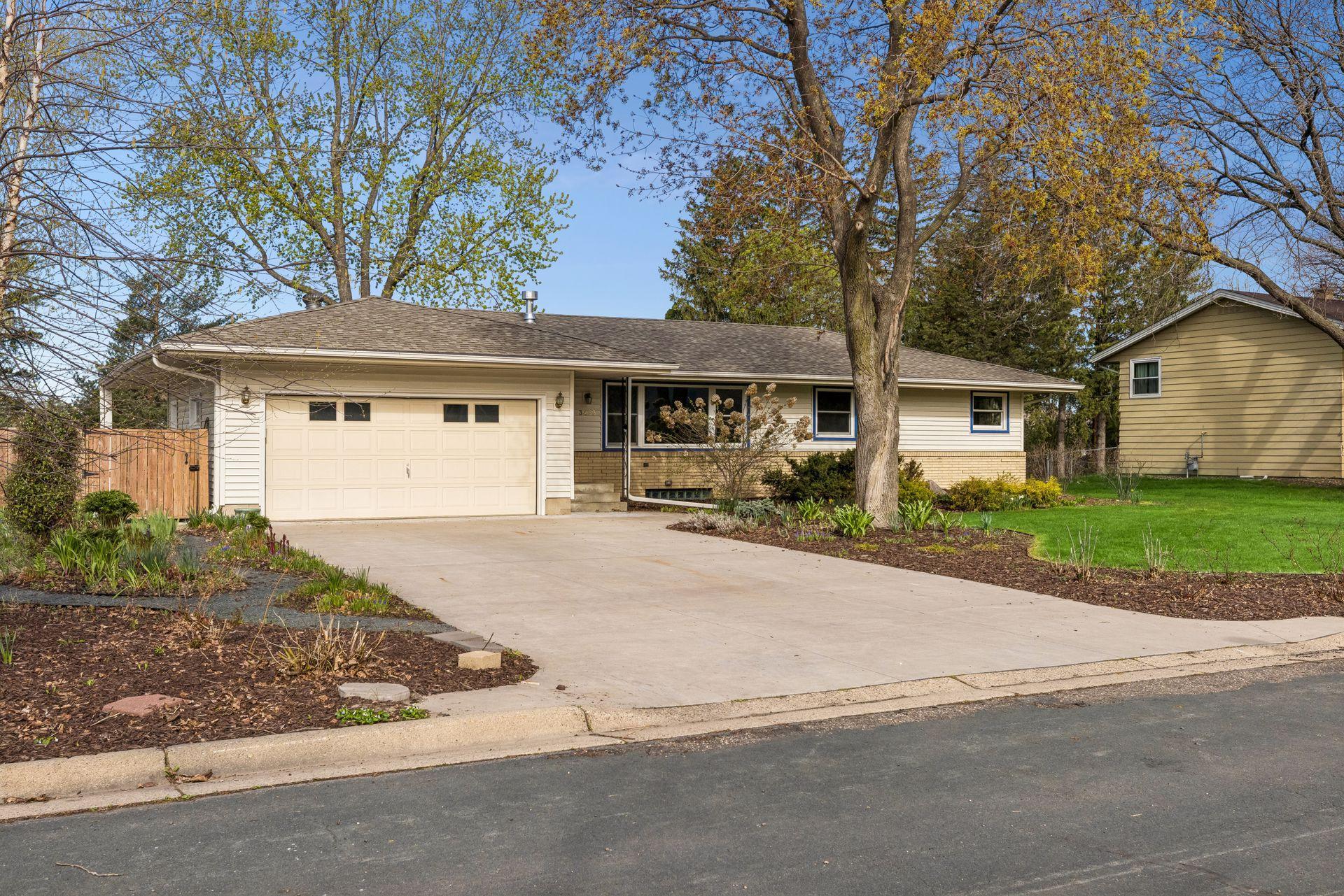 Note all of the low maintenance, gorgeous landscaping that welcomes you.