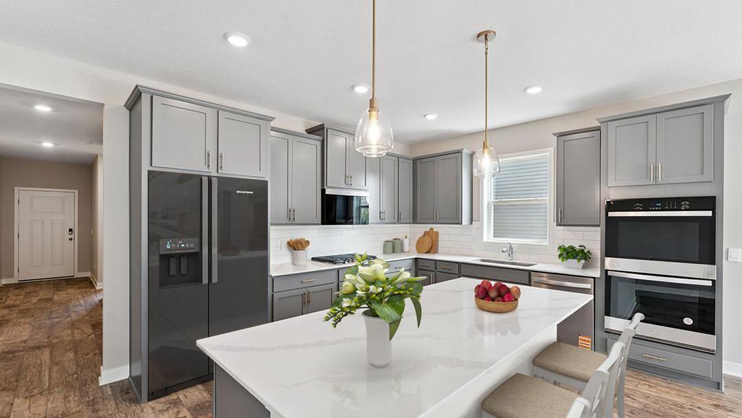 Welcome home to our Dover II Floorplan! Single level living has the perfect balance of open concept with defined spaces for your kitchen, dining and living room needs. Model photo. Options and colors will vary in our available inventory homes.