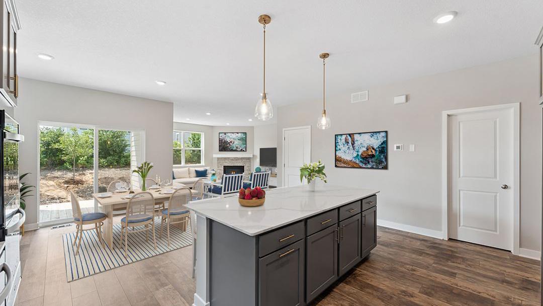 This home's thoughtfully designed layout is sure to impress your guests! Photos of model home. Options, colors and materials will vary in our available inventory homes. Virtually staged photo.