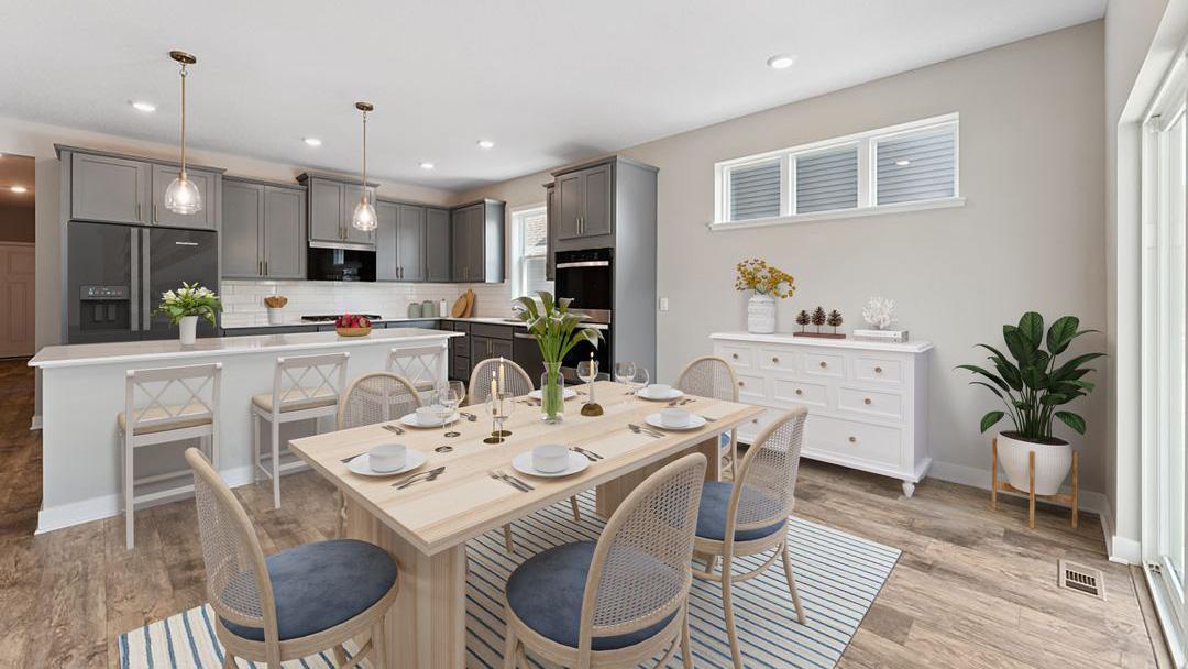 Beautiful kitchen for hosting dinner parties! Model photo. Options and colors will vary in our available inventory homes.