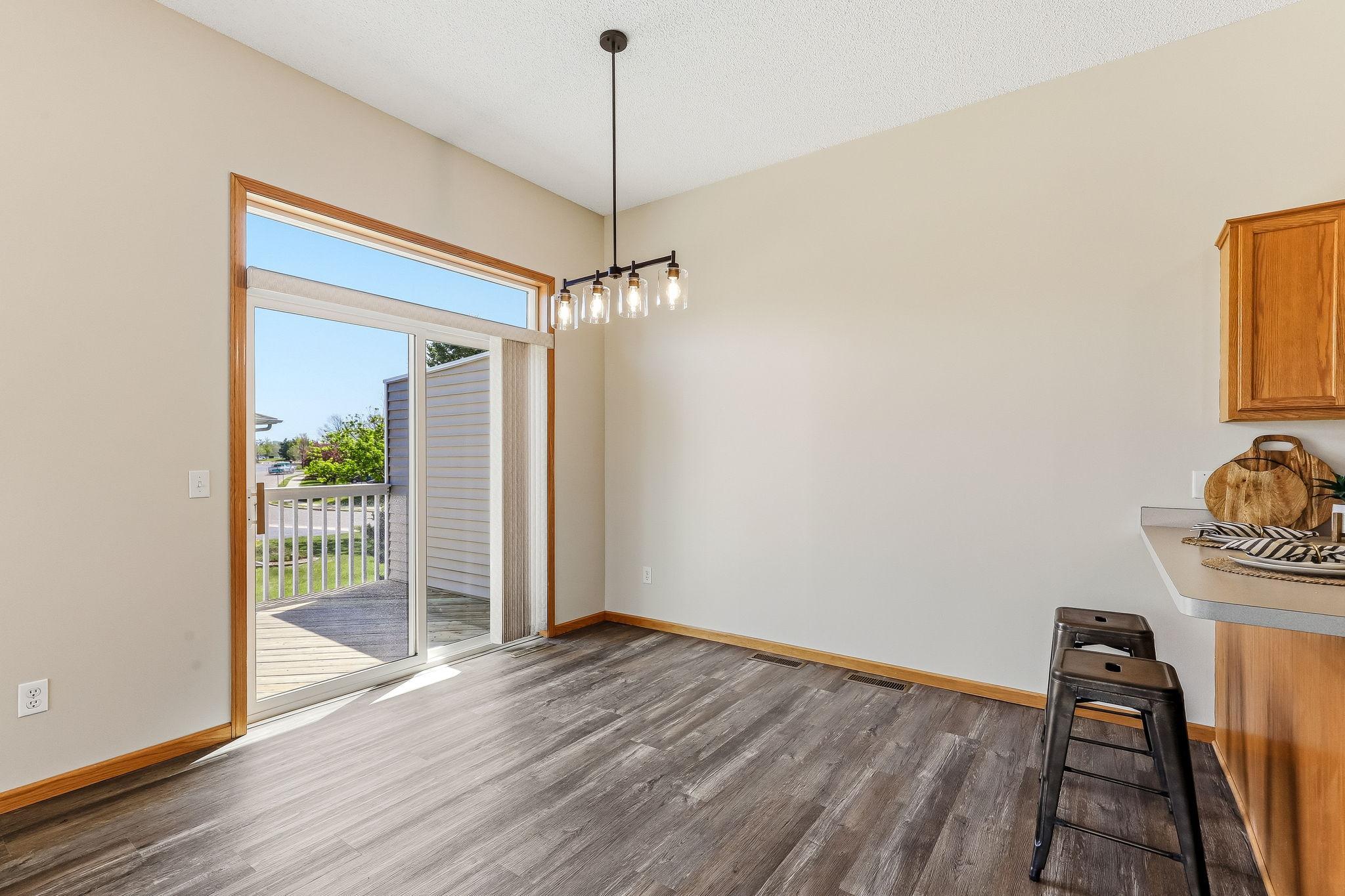 1505 Senate Lane - Sliding glass door to deck and transom window flood the dining area with light. Brand new paint, flooring, and light fixture!