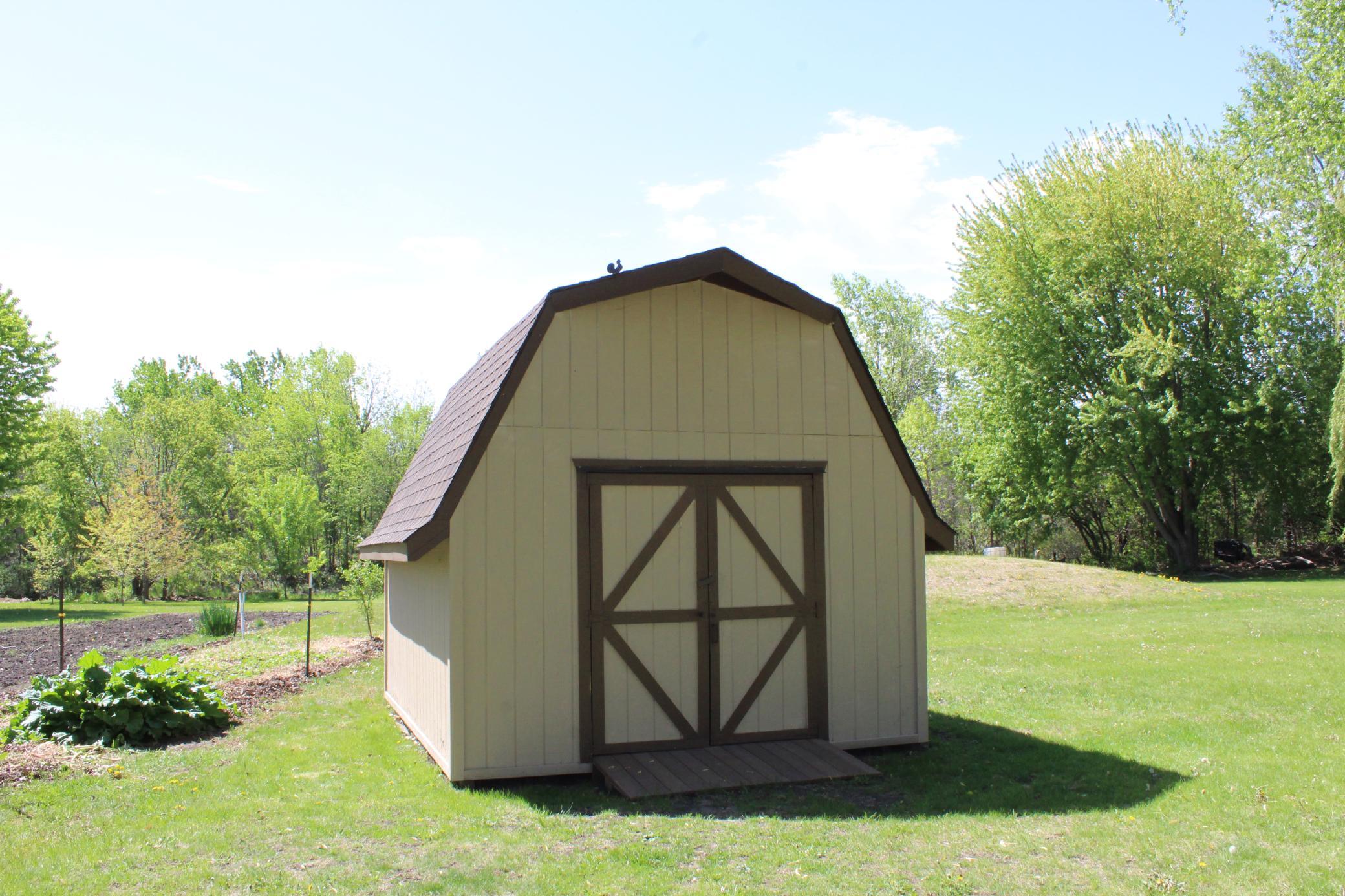 The 16x12 storage/garden shed sits conveniently close to the garden and has a loft for additional storage!