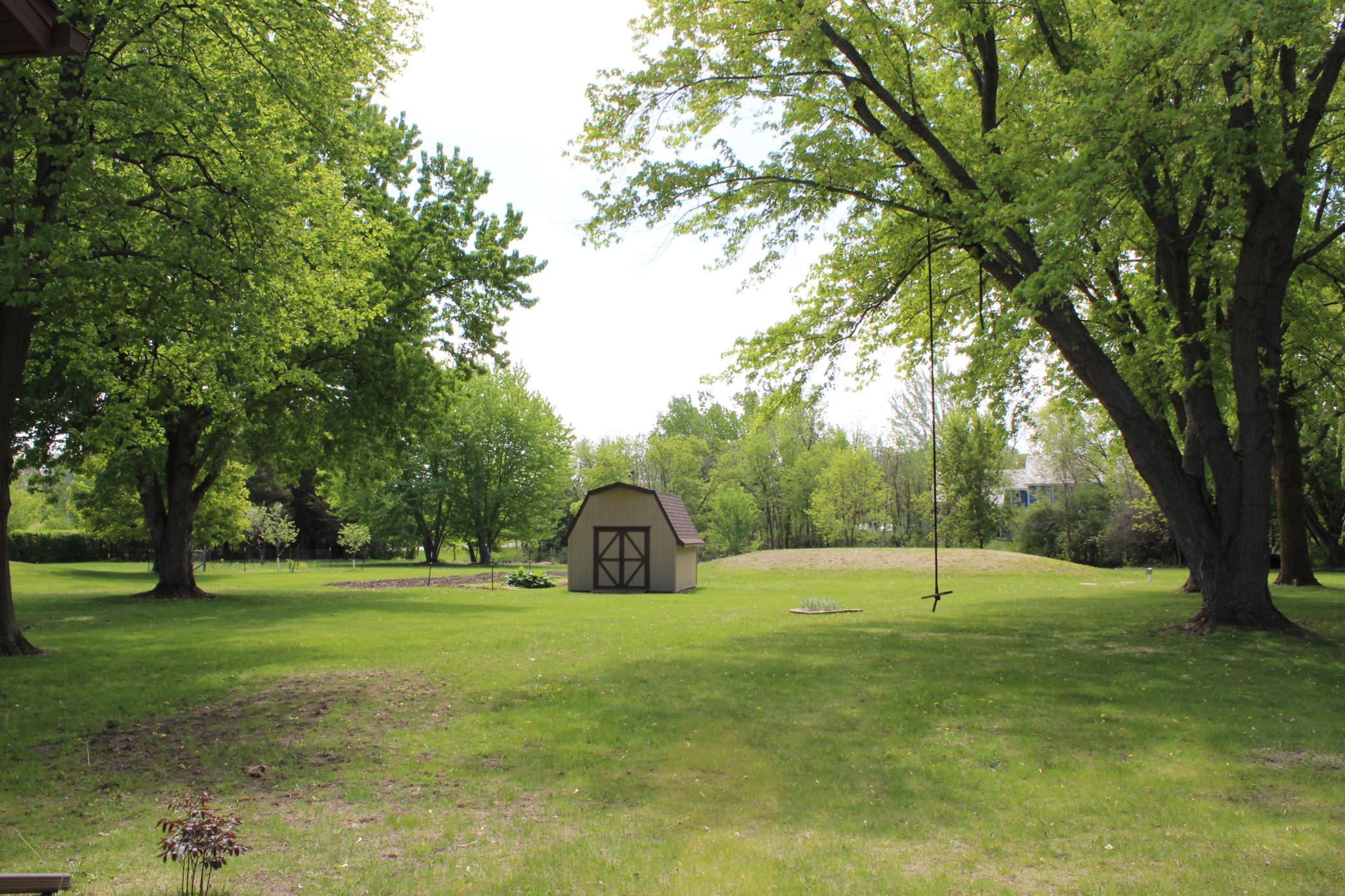 There is so much to love about the back yard. Great mix of open space and mature trees!