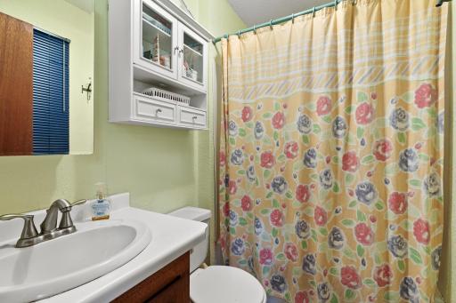 Full bathroom with cabinet space for your bathroom essentials.