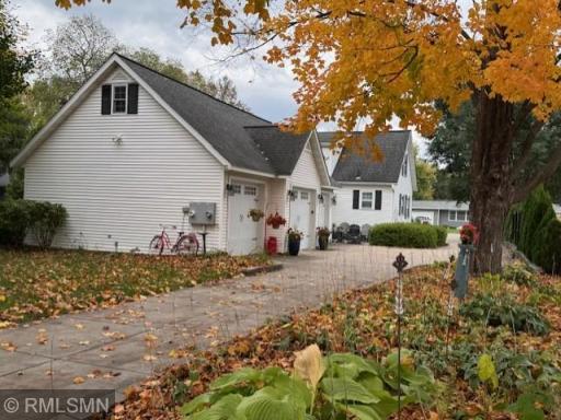 3 car garage features oversize overhead doors and above walk-up storage area
