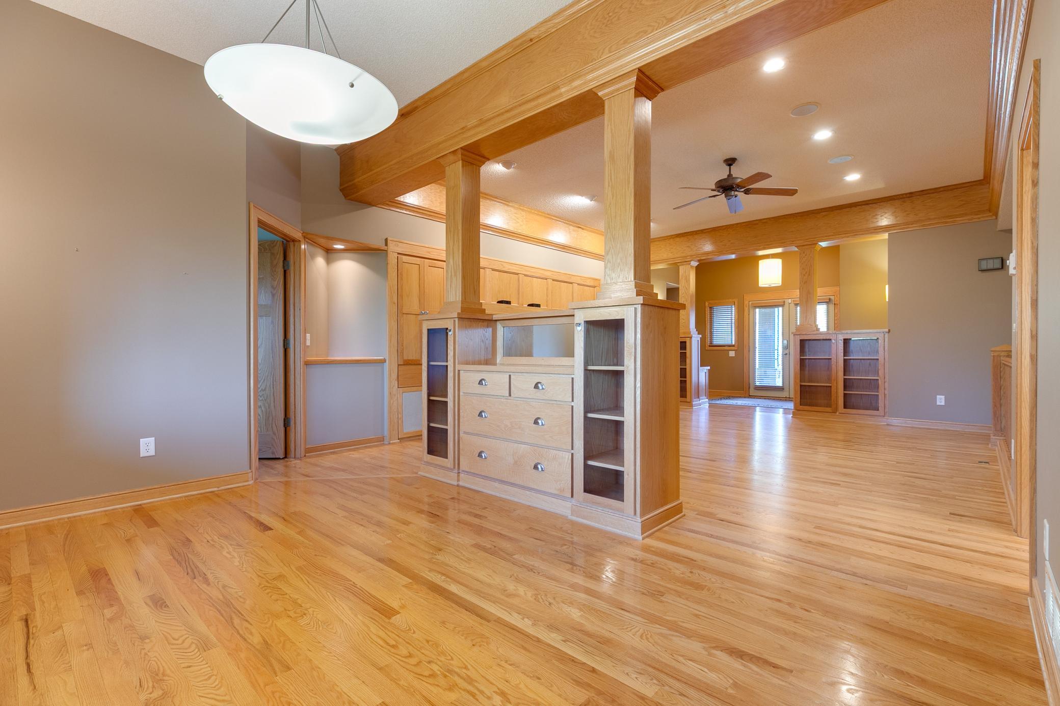 The formal dining room, with built-in buffet cabinet, can comfortably seat six to eight guests.