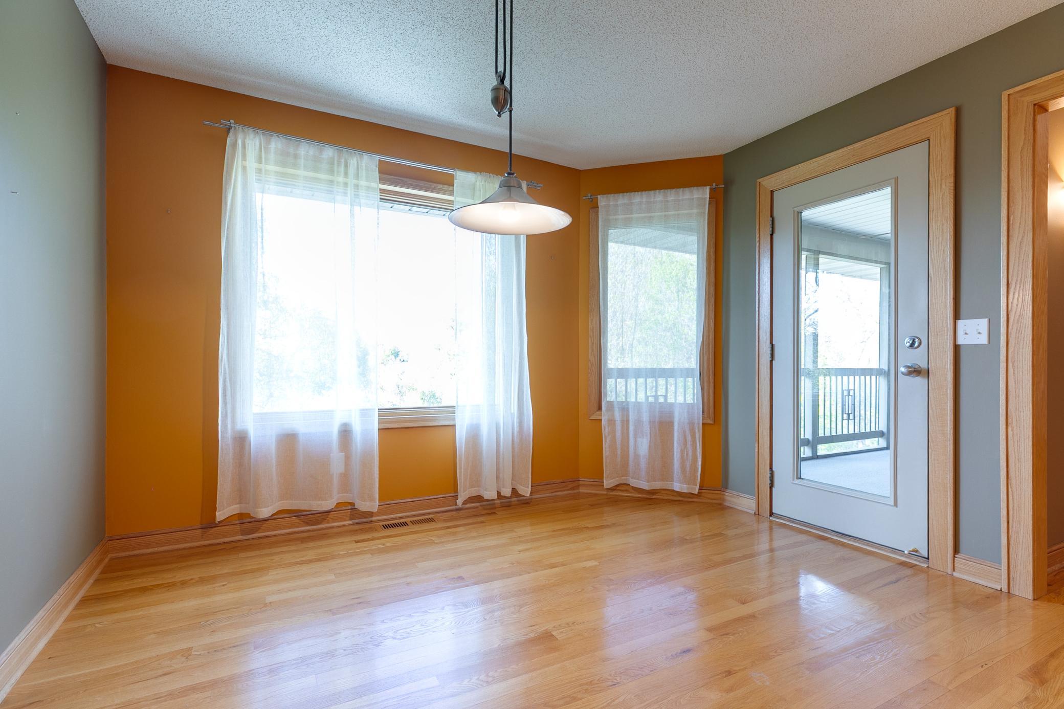 The informal dining area leads to the screened porch.