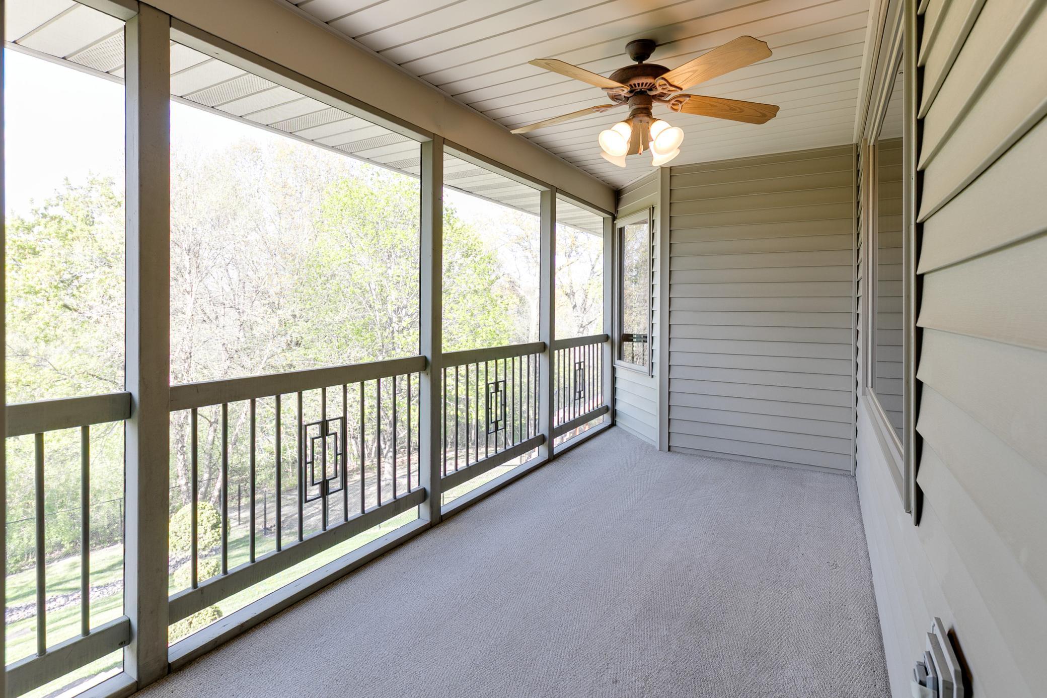 Enjoy a cup of iced tea or hot coffee in this screened porch.