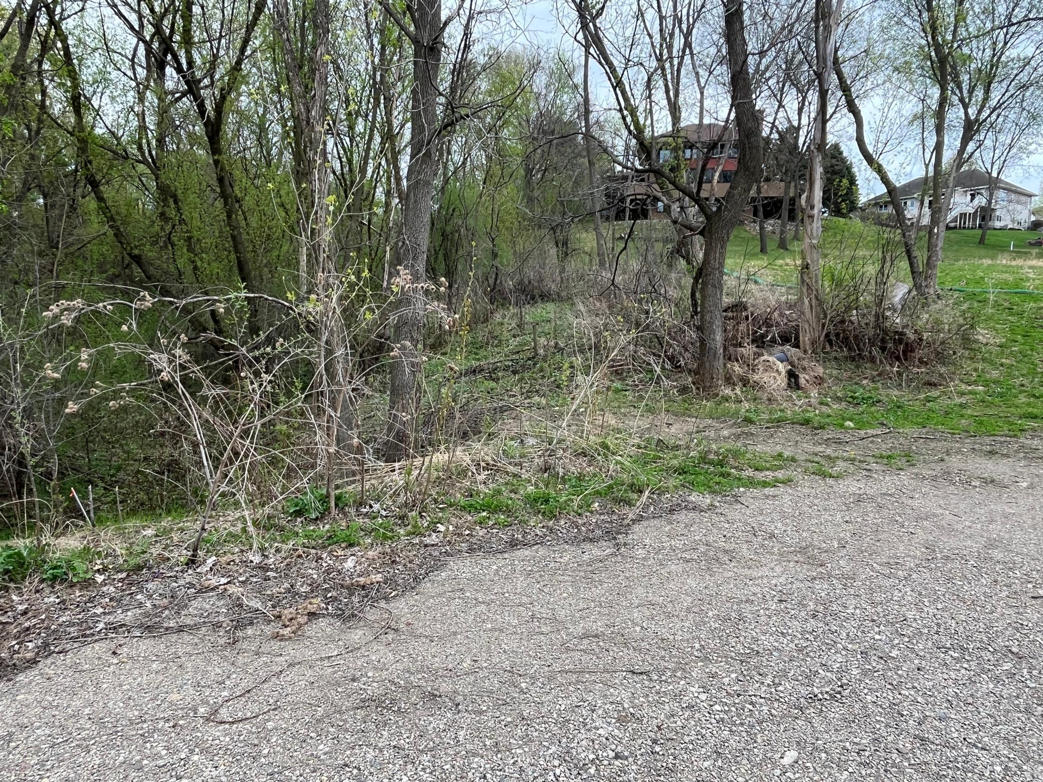 The private road/drive has been upgraded to construction grade and goes over a small ravine/creek.