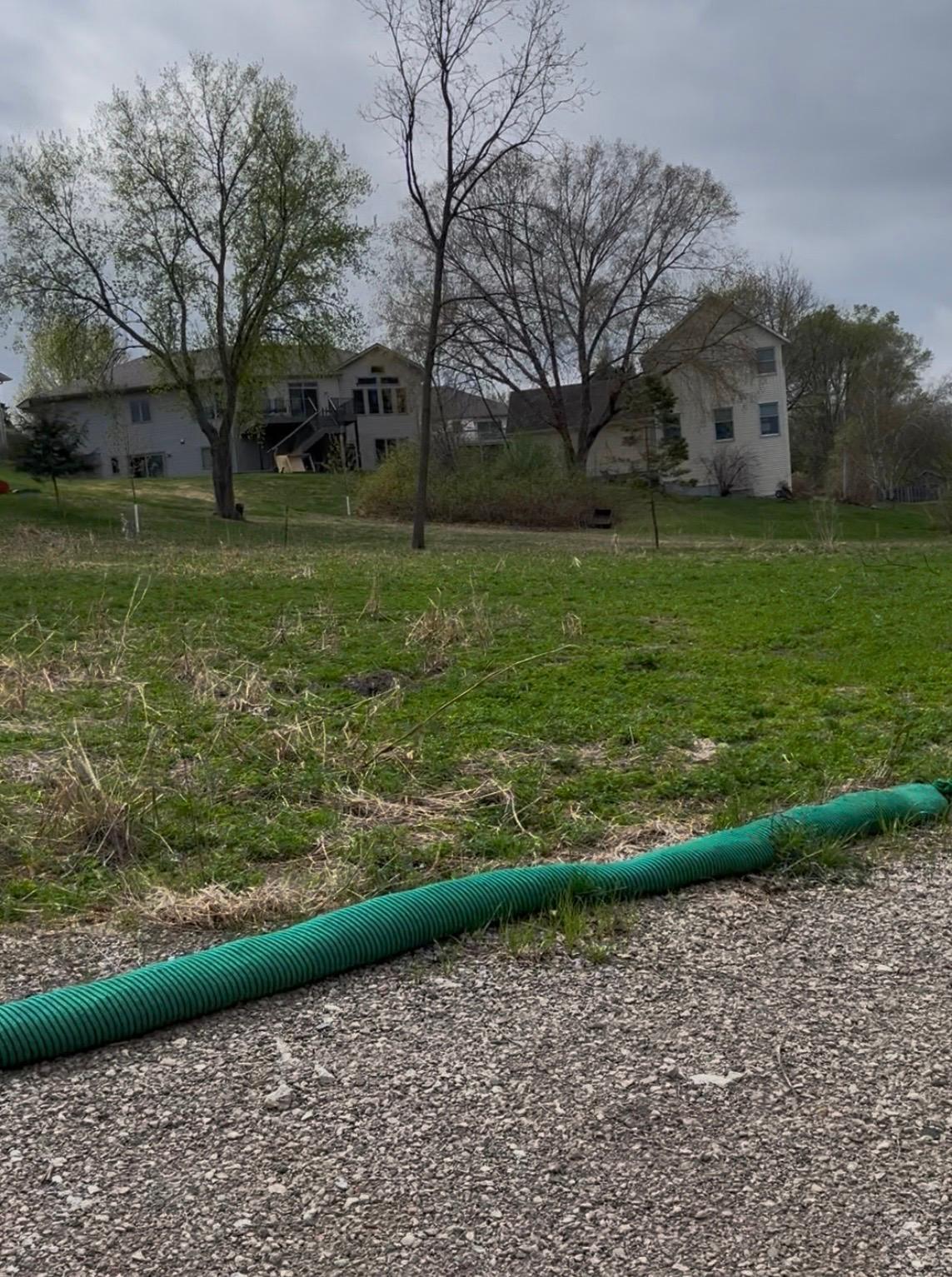 The lot was cleared, rough graded and hydroseeded. The silt barriers remain in place.