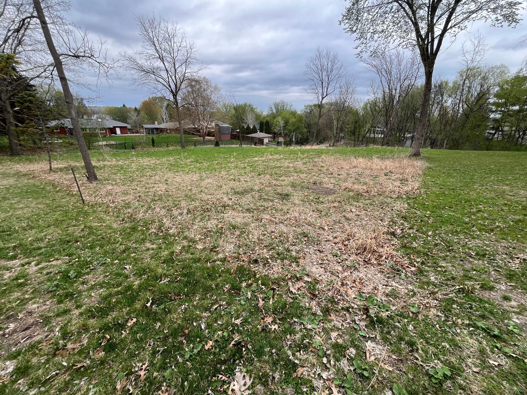 This shows the approximate east and part of the south lot line. Photo taken from SE corner looking NW.