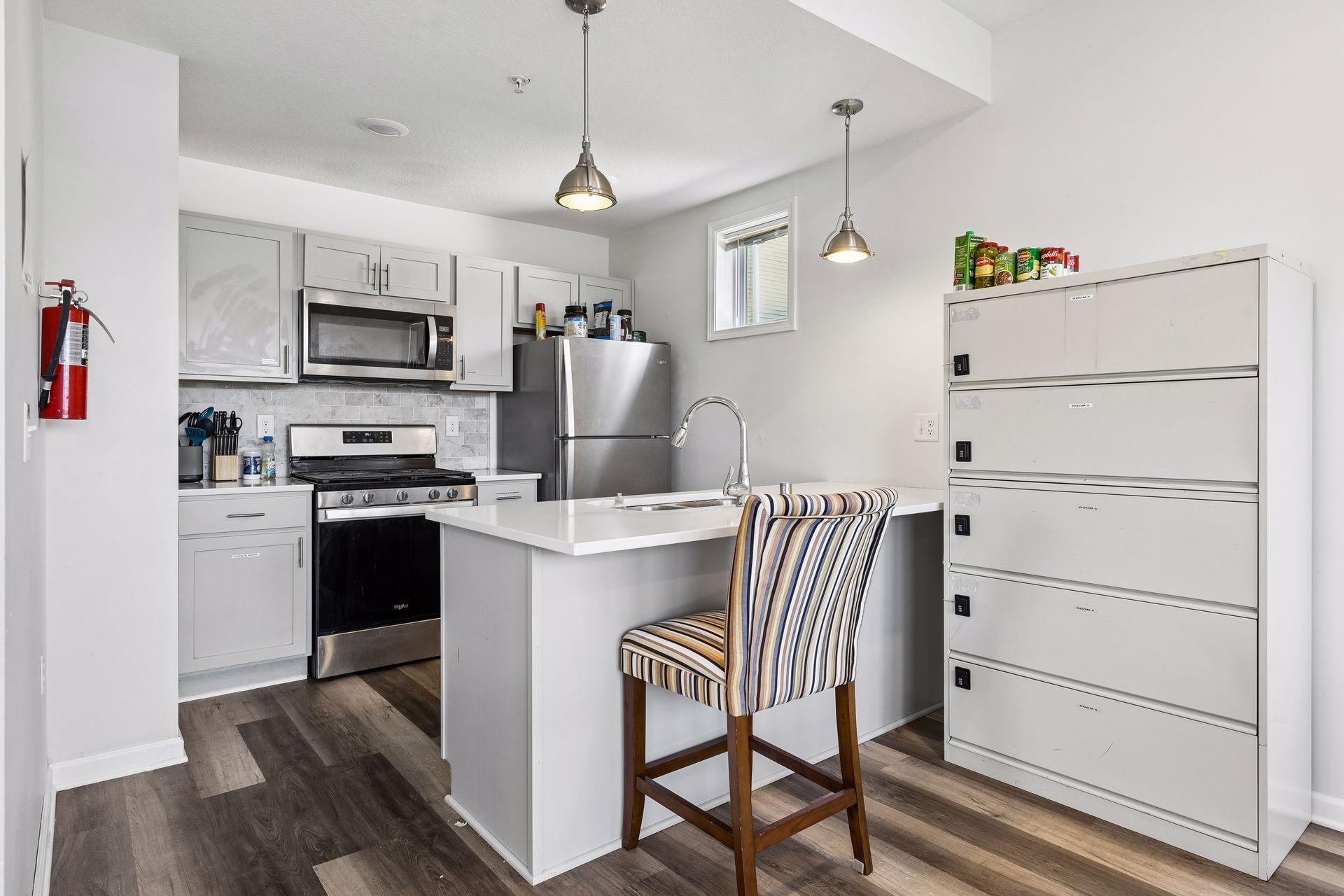 Kitchen with island, granite and stainless appliances