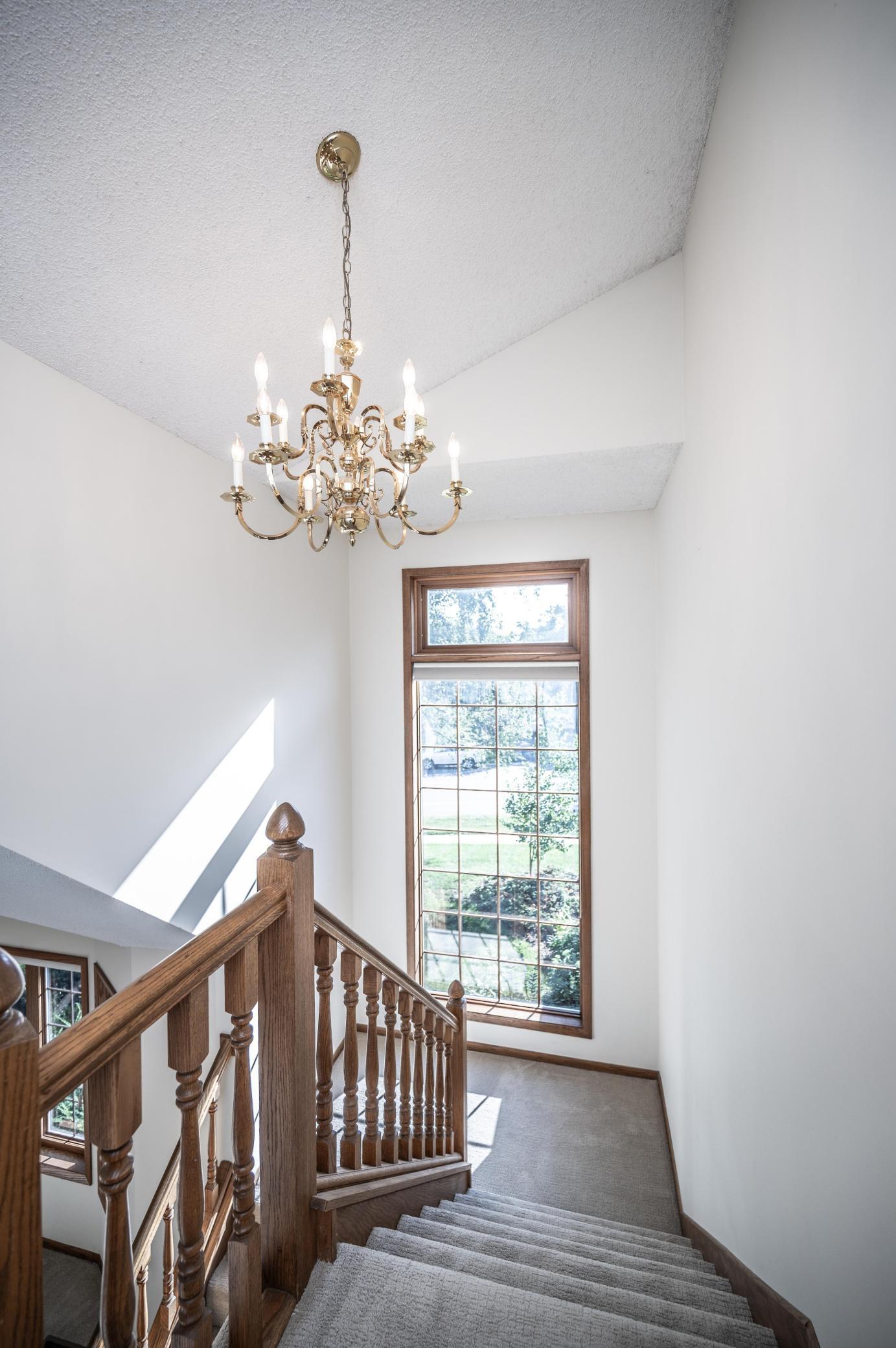 Large window is featured on the landing leading to the upper level