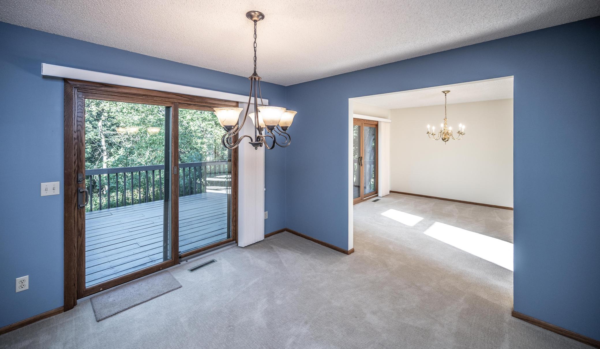 Another view of the informal dining area with a sliding glass door leading to the deck - convenient for entertaining outdoors. Newer carpet.