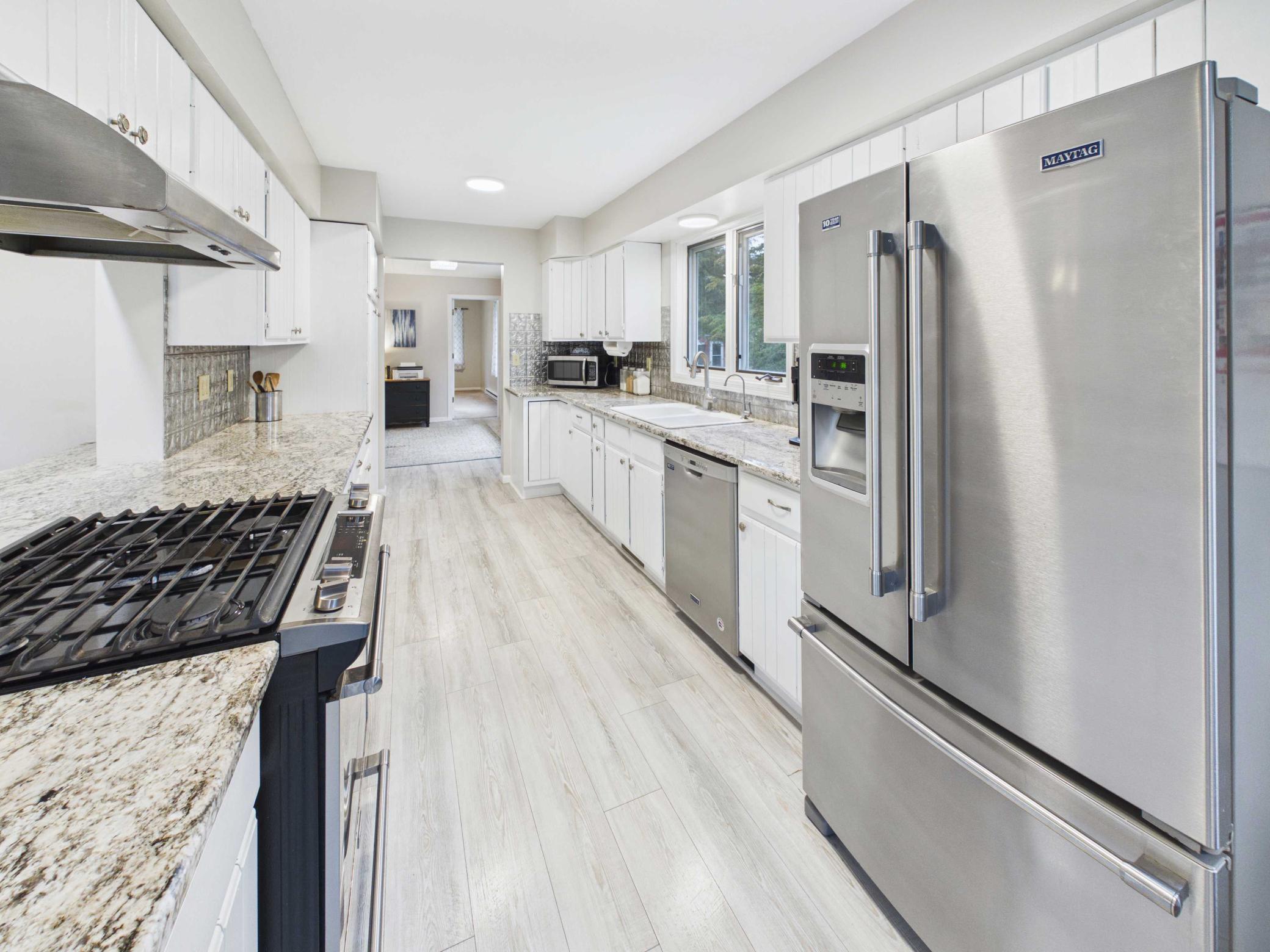 Kitchen area with SS appliances