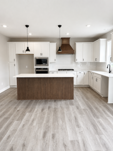 Gourmet kitchen with ample counter space! Featuring quartz countertops and stainless-steel appliances.