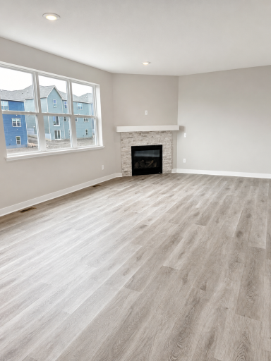 Actual photo of 917 Foxglove Terrace. Gas fireplace with stone surround.