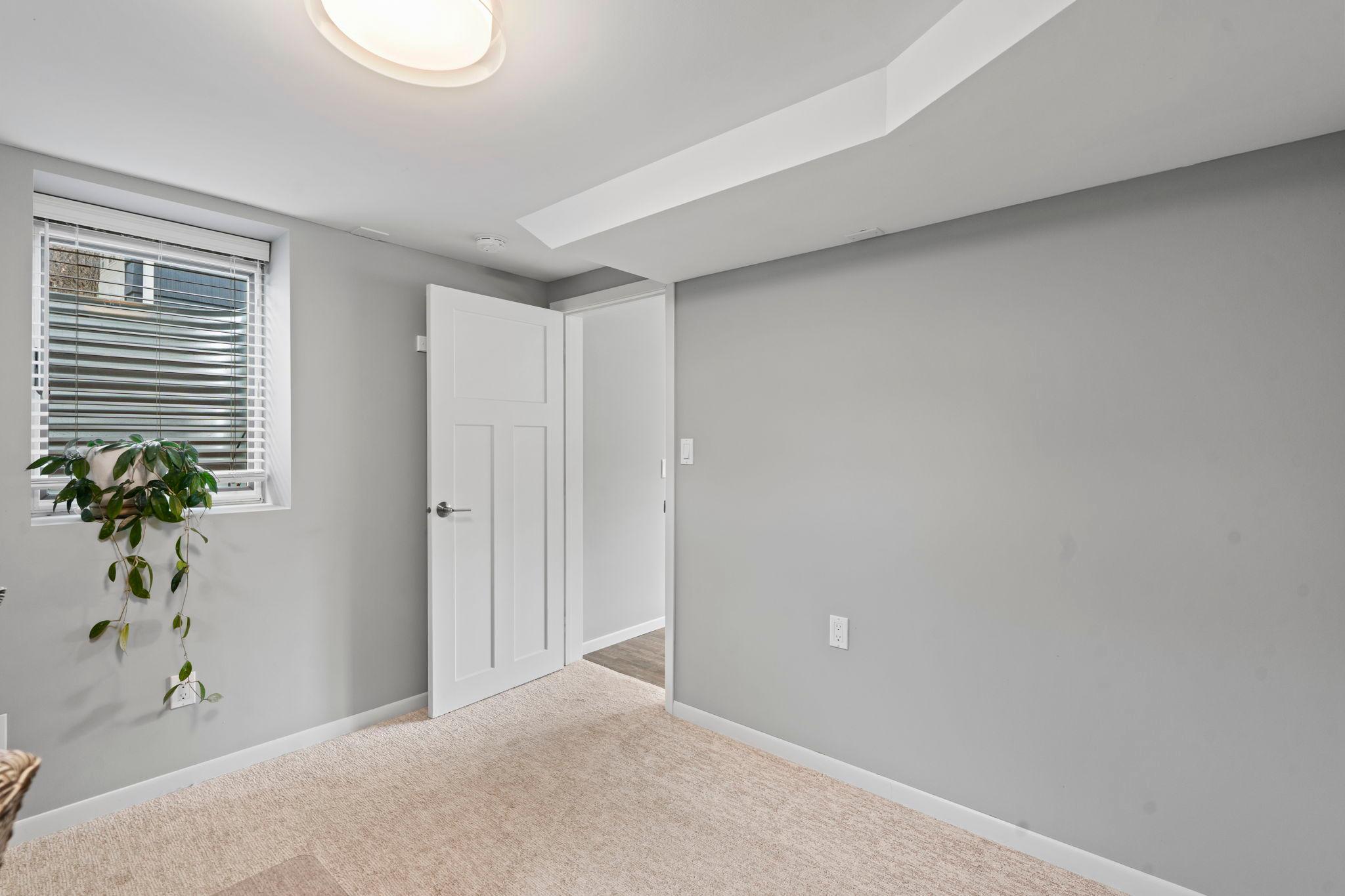 4th bedroom in the lower level with egress window.