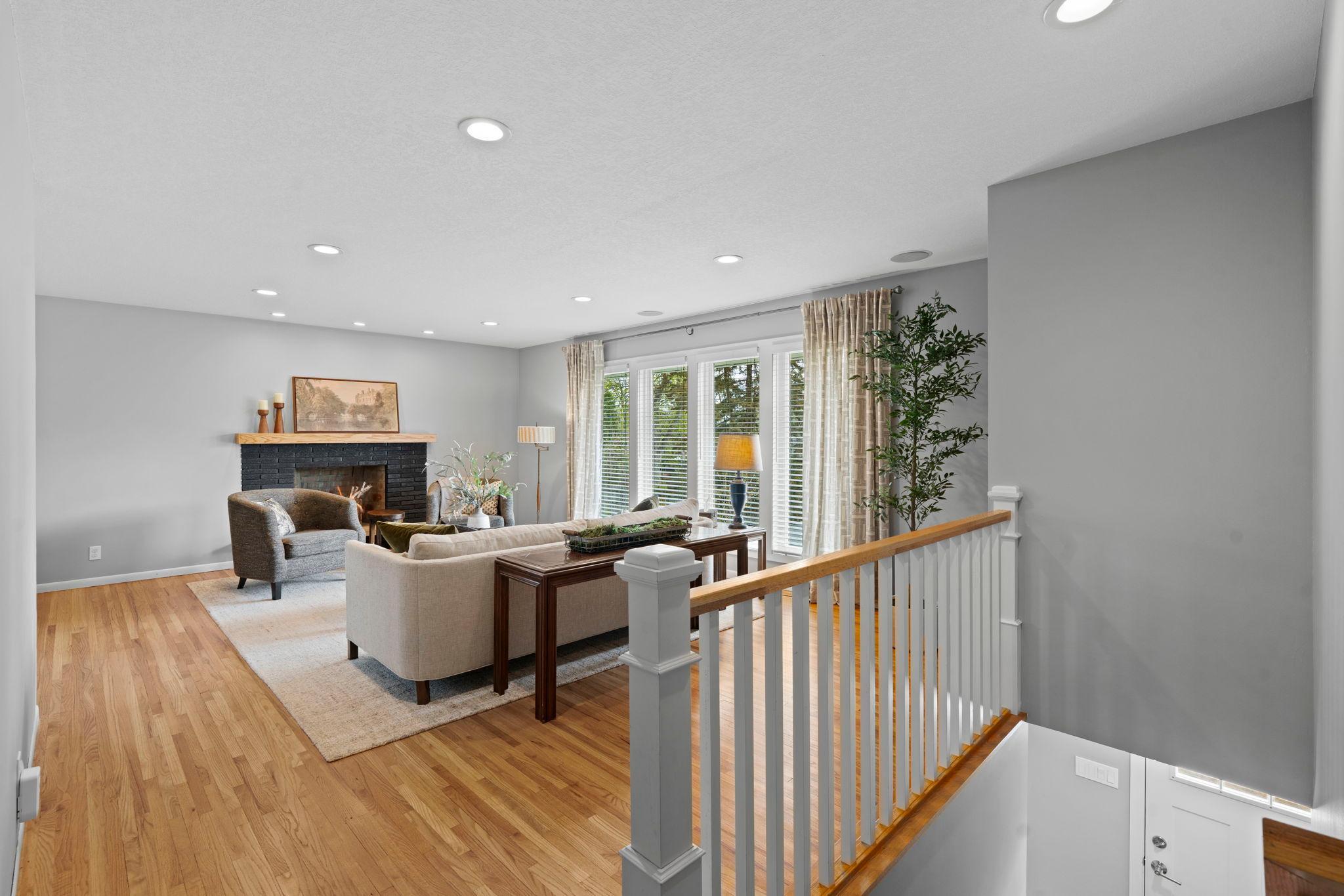 Stylish modern colors, white trim, open banister.