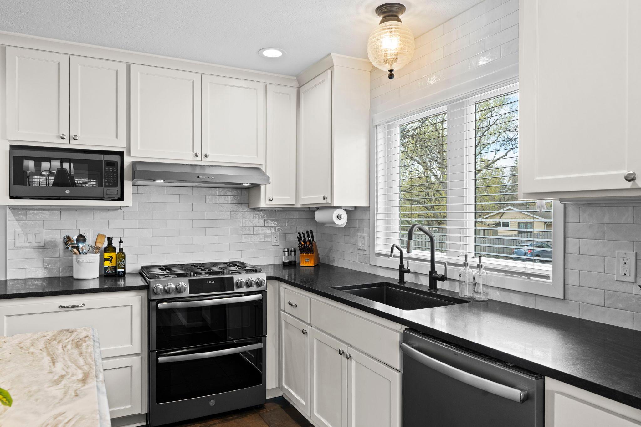 Light and bright kitchen with subway tiled backsplash.