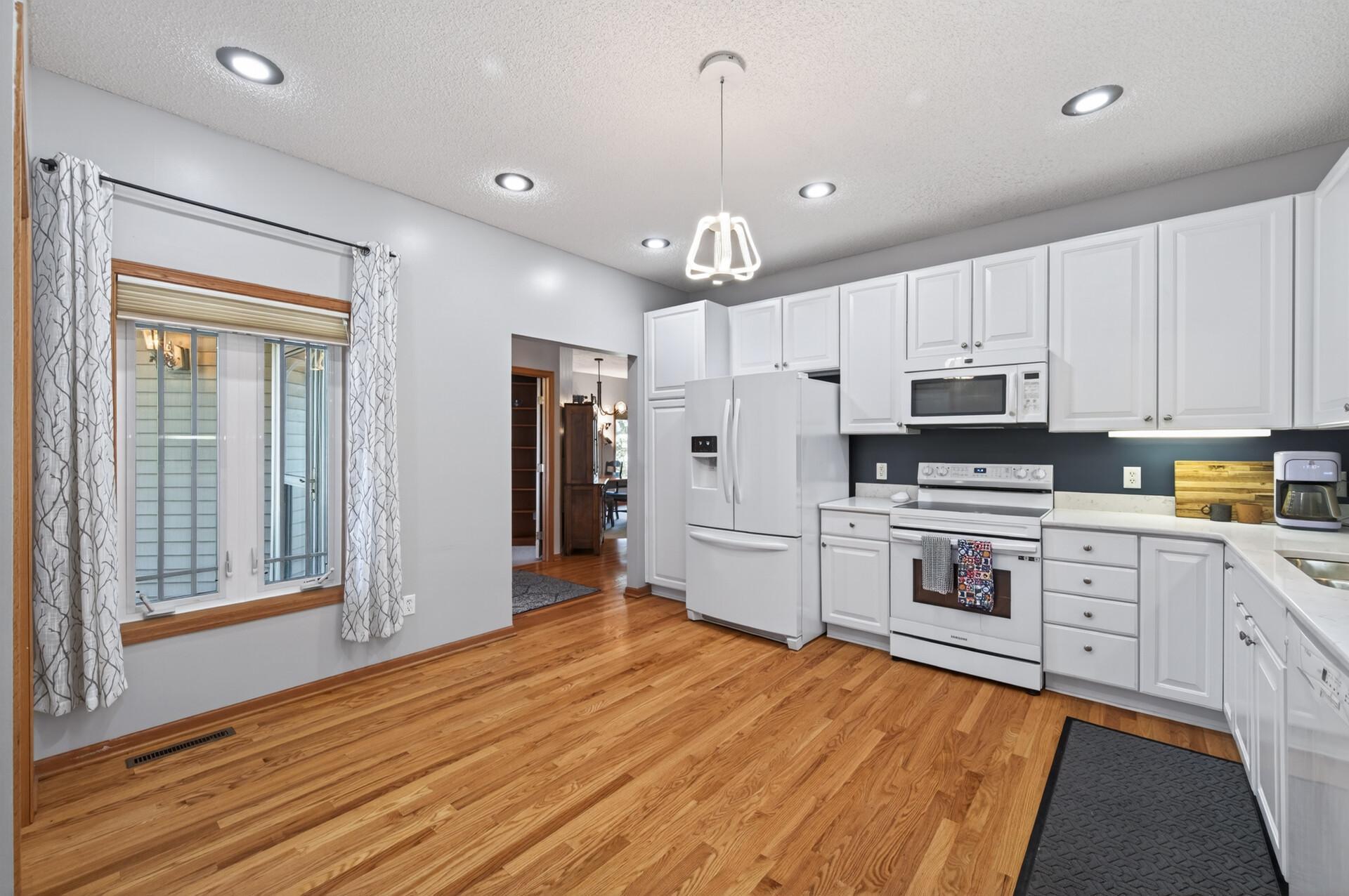 The kitchen is spacious with ample storage.