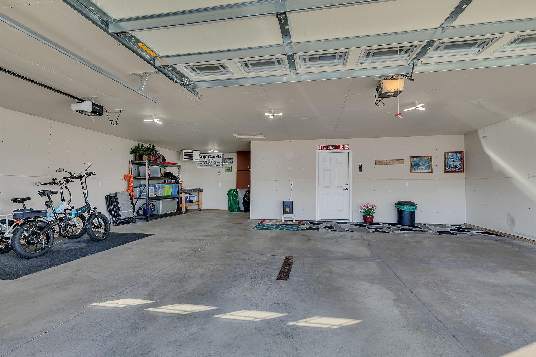3 car insulated and heated garage with extra storage area off the 3rd stall