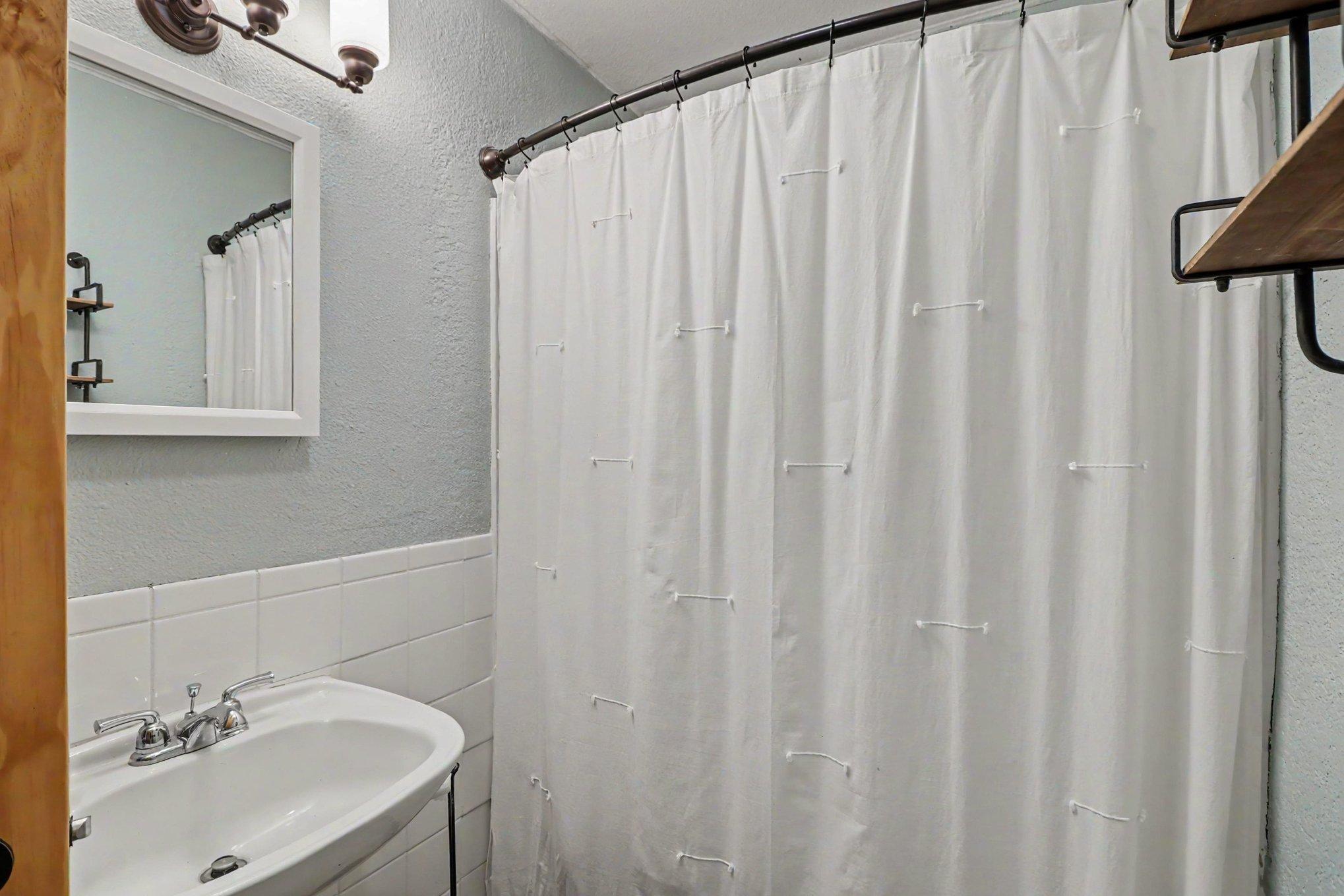 Full bathroom on main level with tub/shower combo — 305 Oak Ave SE Montgomery MN