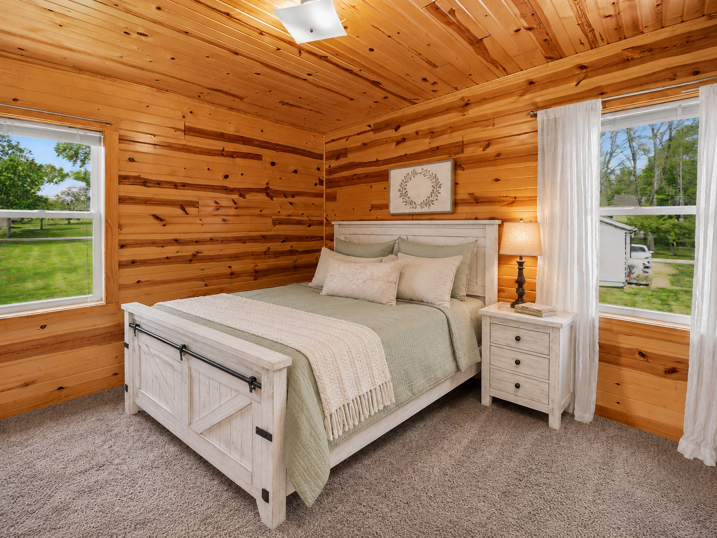 Second main floor bedroom with pine plank walls, natural light, and 6-panel solid door (virtually staged to show potential)
