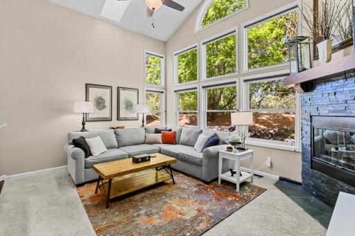The living room has vaulted ceilings, skylights, and a new slate tiled fireplace.
