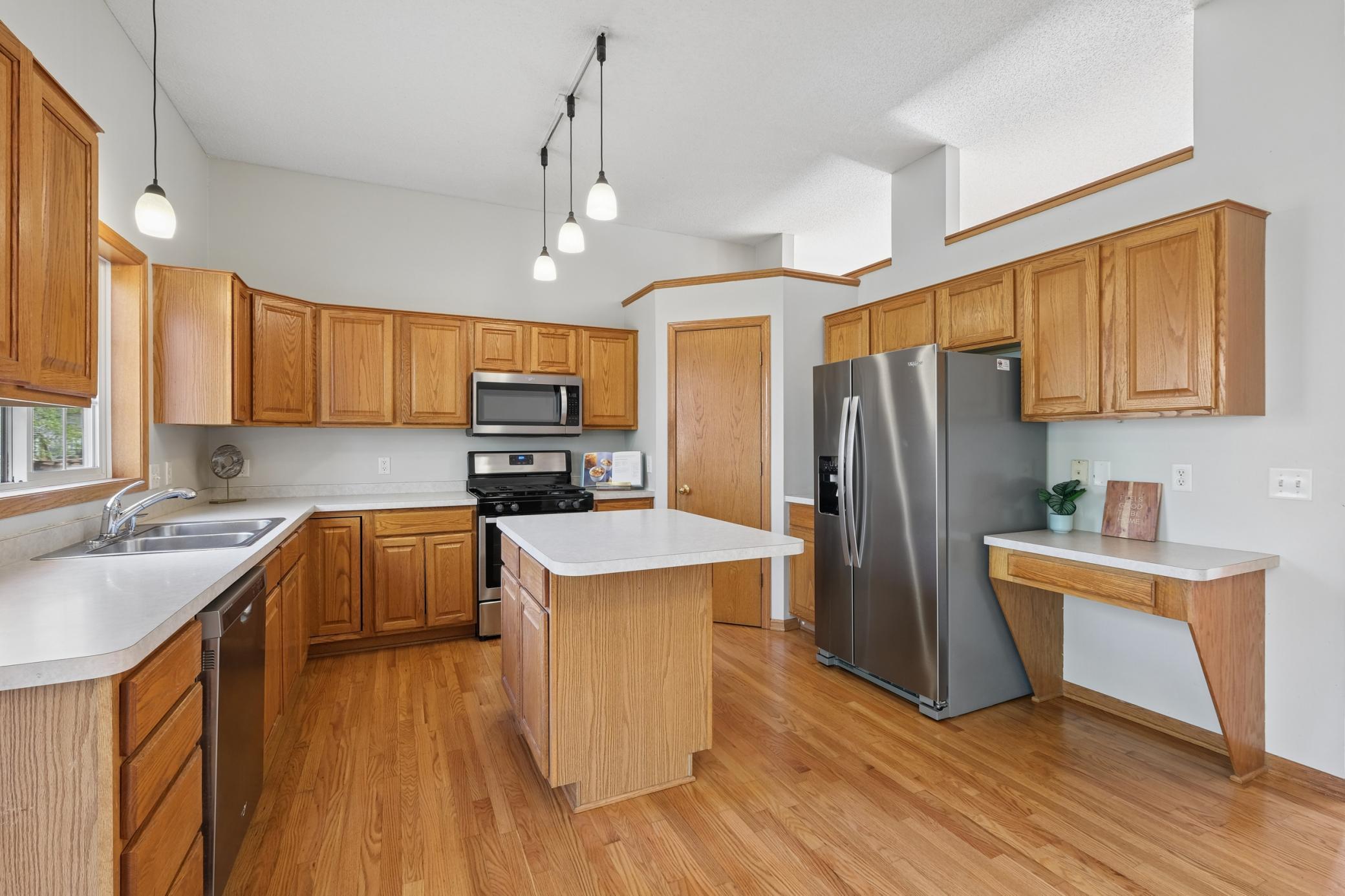 Lots of kitchen cabinetry and walk-in pantry