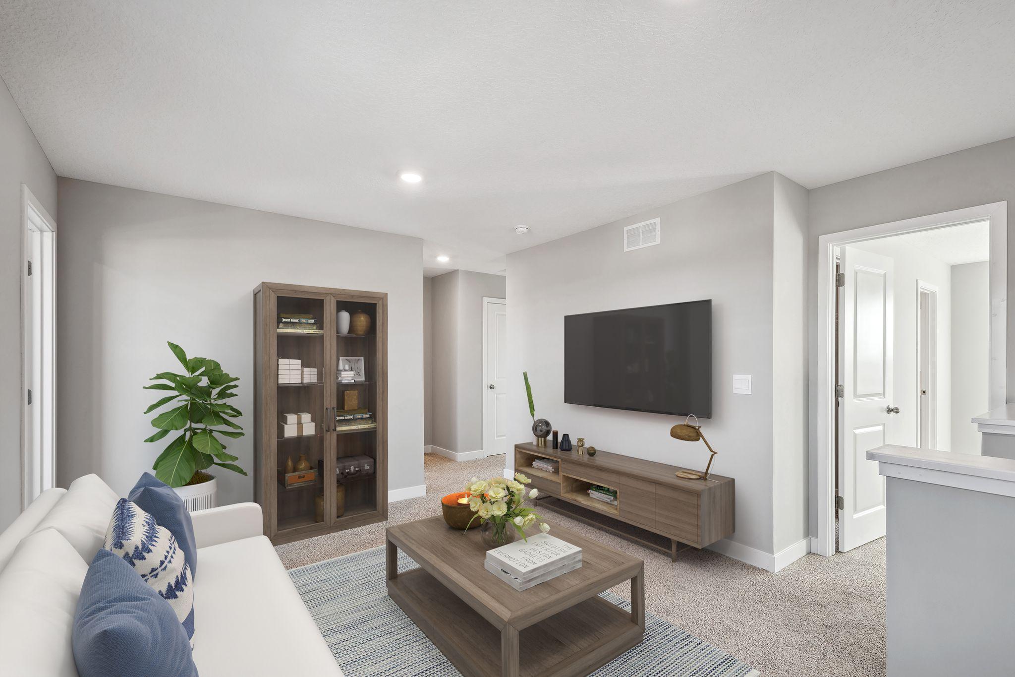 Upstairs you will find a large loft that centers the bedrooms