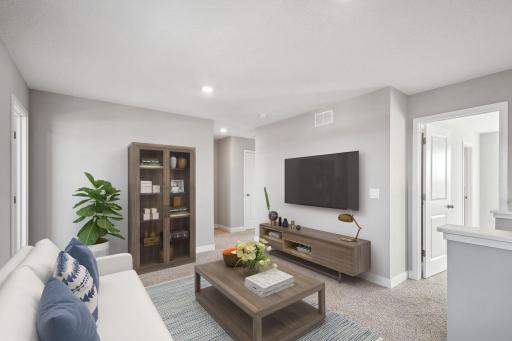 Upstairs you will find a large loft that centers the bedrooms