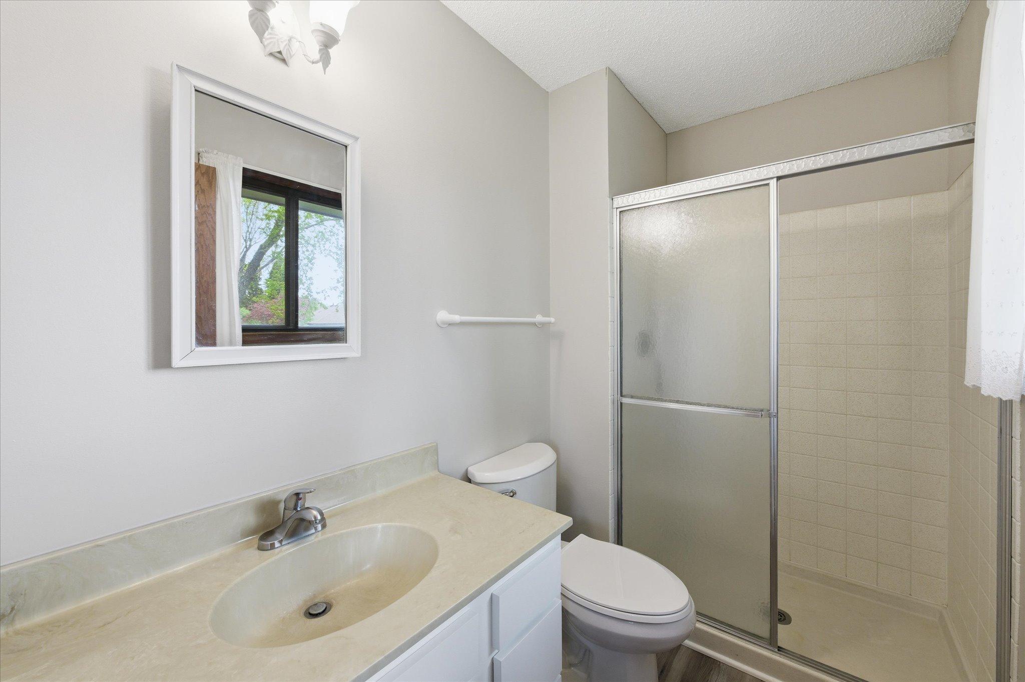 The private 3/4 ensuite bathroom offers convenience and comfort with a clean, functional layout designed for everyday living.