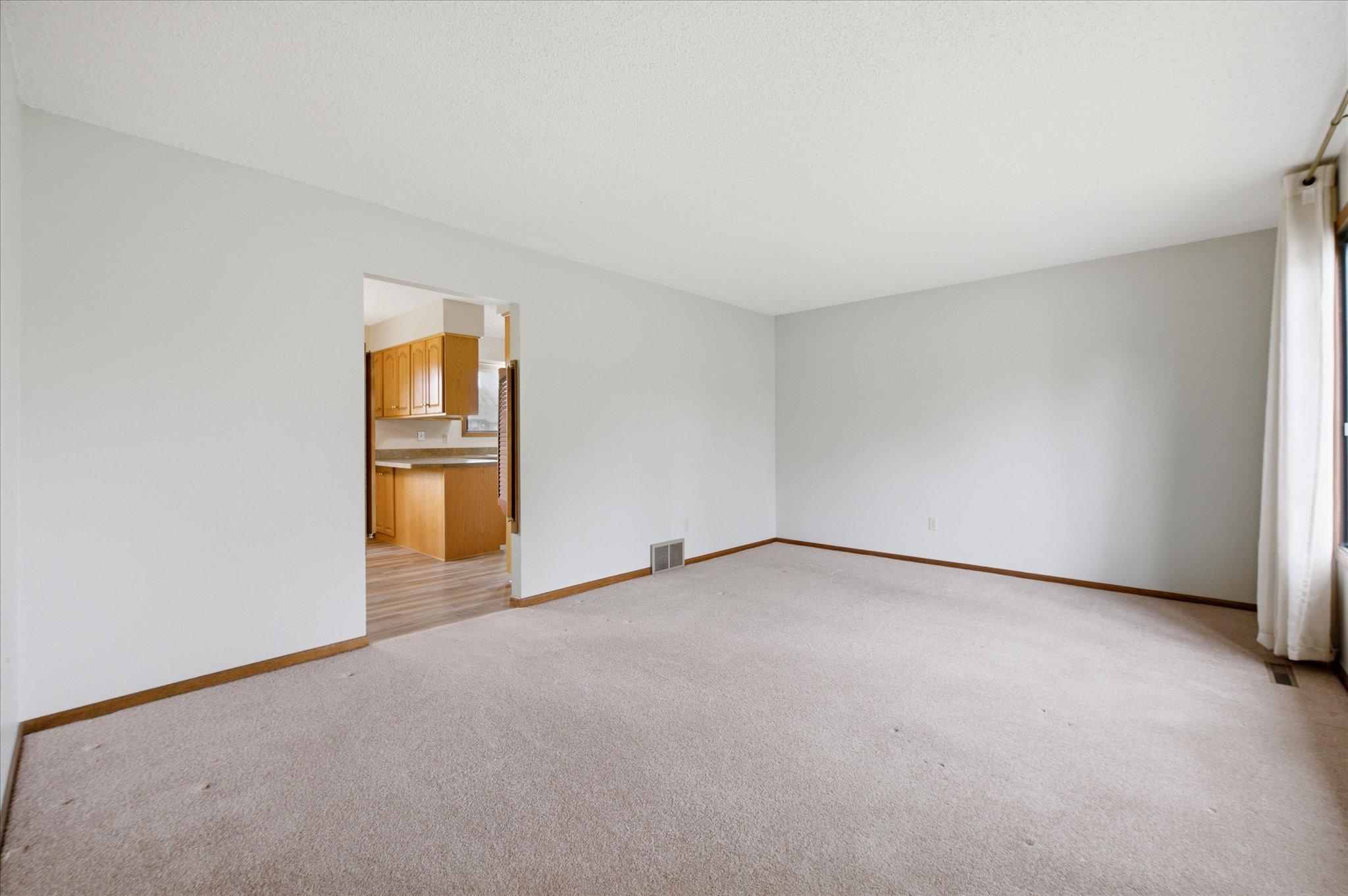 The spacious living room offers the perfect setting for relaxing evenings or gathering with guests.