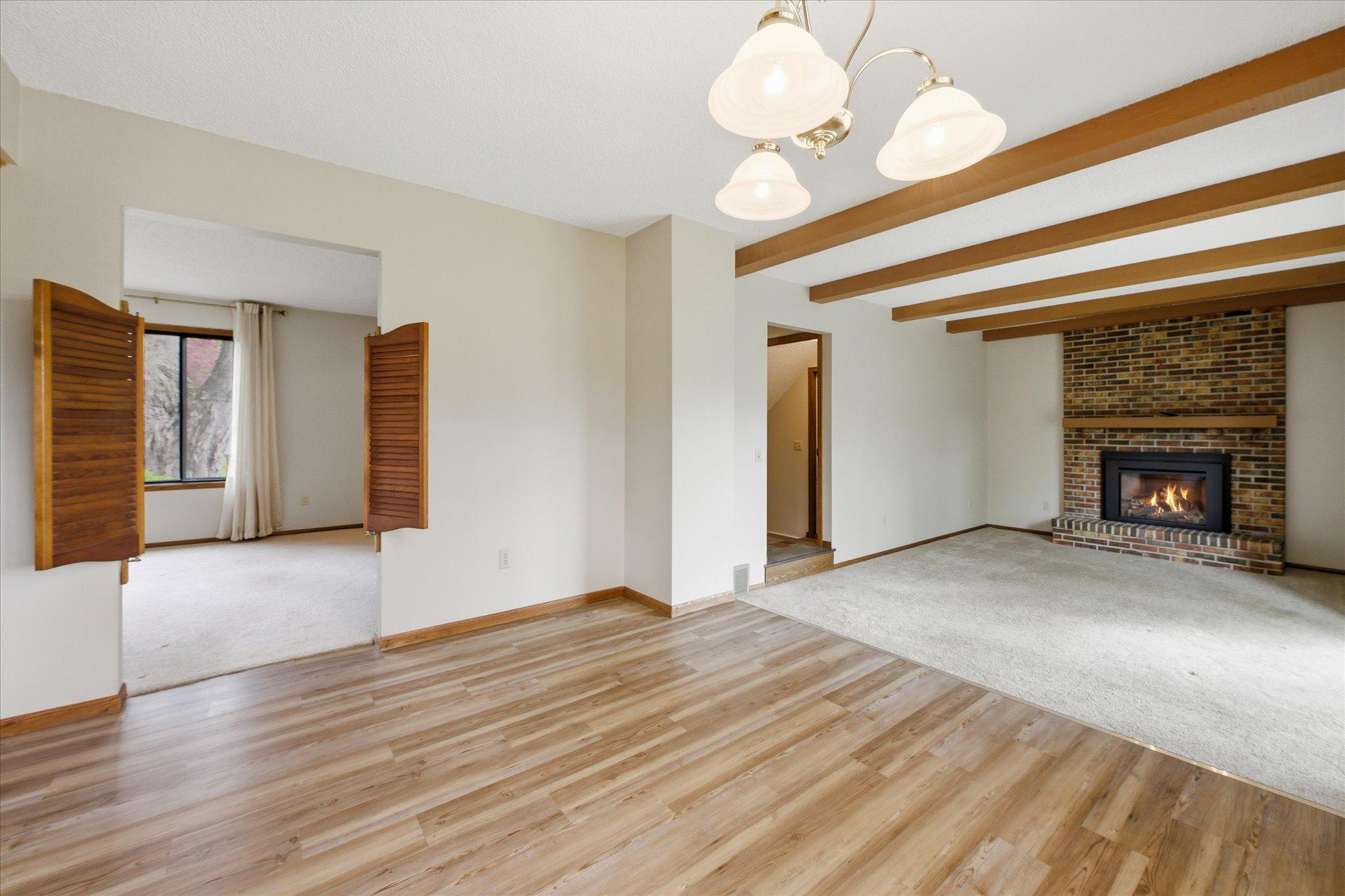 This angle perfectly showcases the thoughtful layout of the home, with the living room to one side and the family room just across from the dining area.