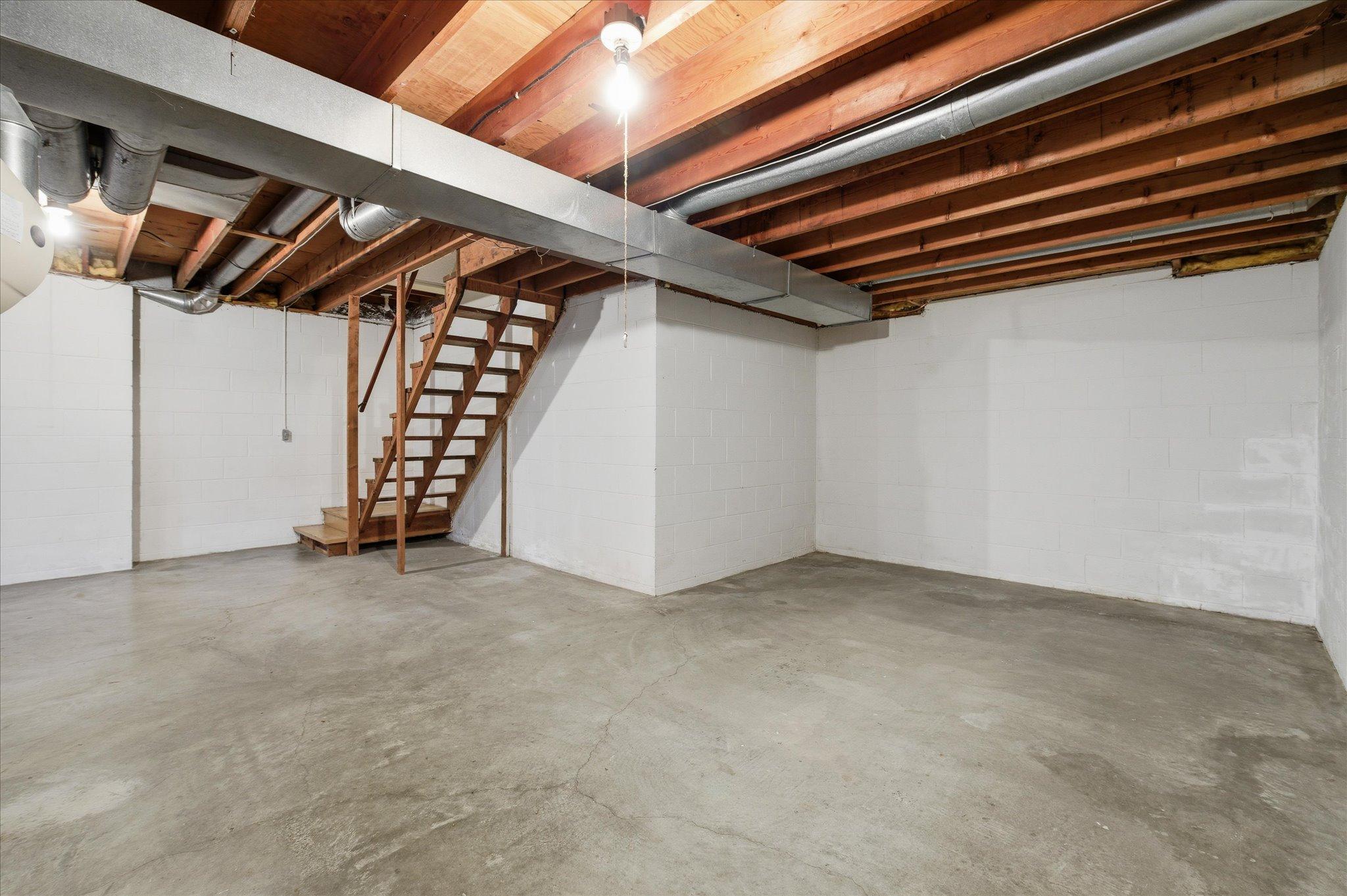 The unfinished lower level is a blank canvas ready for your vision.