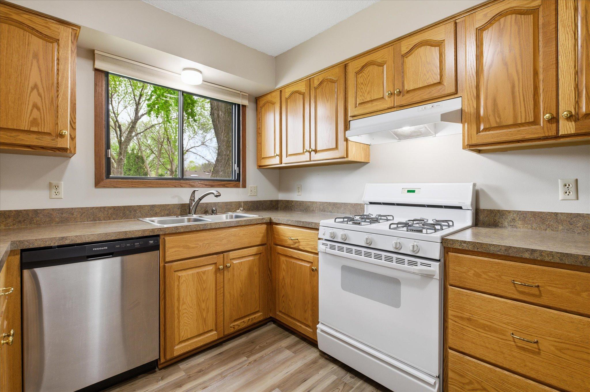 The kitchen offers abundant cabinetry and generous storage space, making organization simple and meal prep enjoyable.