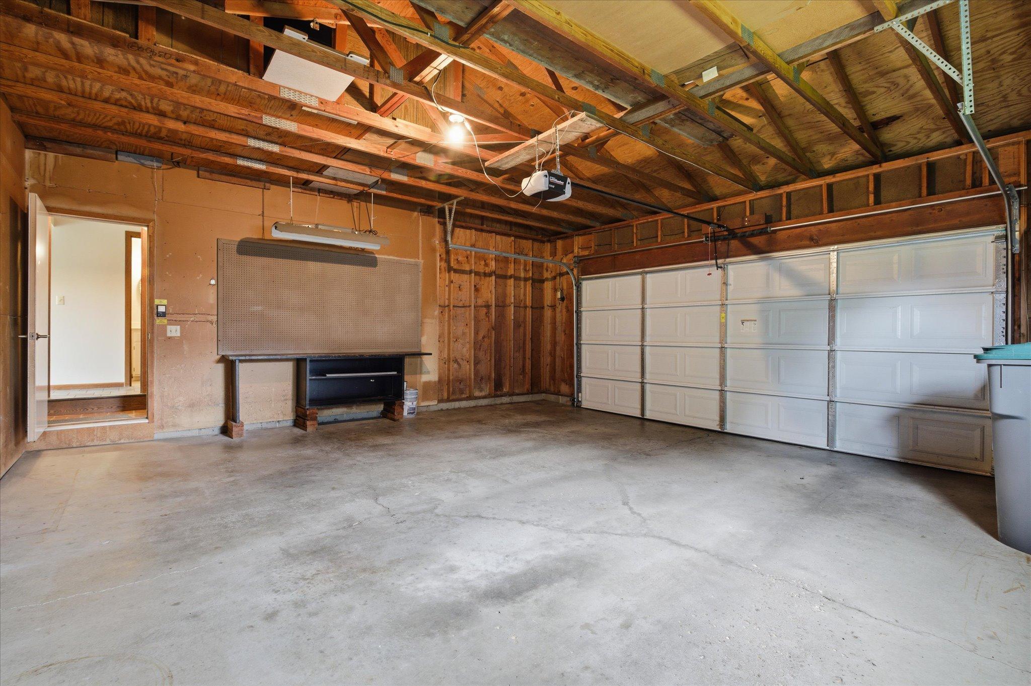 he attached garage provides excellent space for vehicles, tools, storage, and everyday convenience.