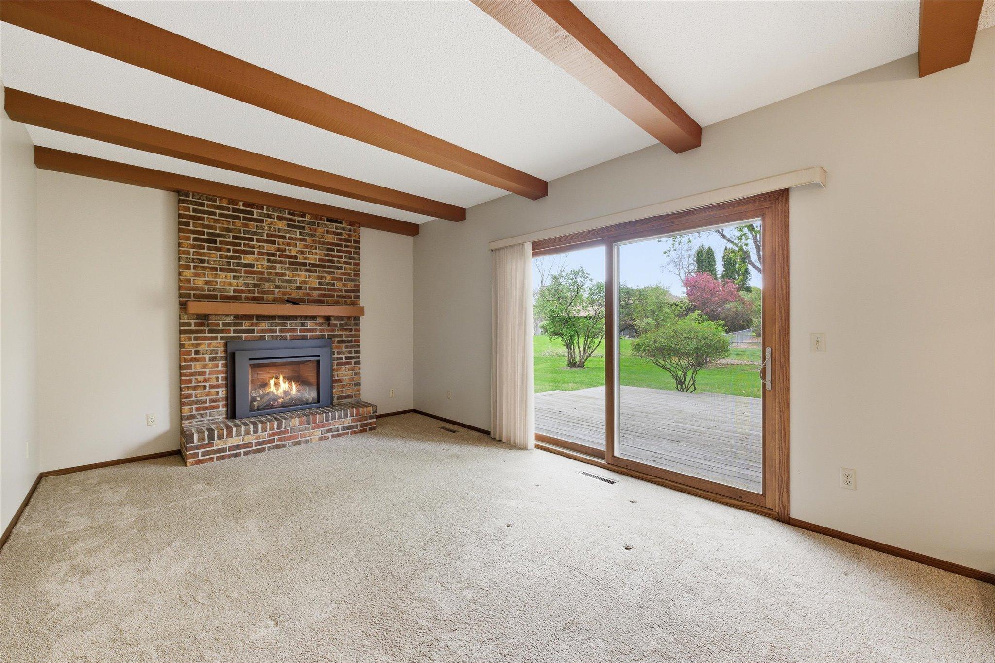 The family room creates a warm and inviting atmosphere with direct access to the backyard deck, making indoor-outdoor entertaining effortless.