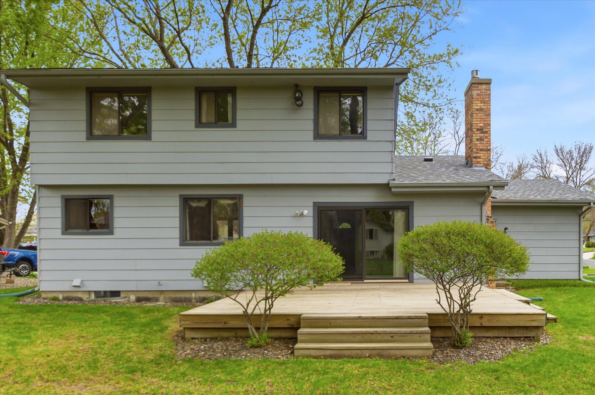 The backyard and deck create the ideal setup for summer barbecues, outdoor dining, and peaceful evenings under the stars.
