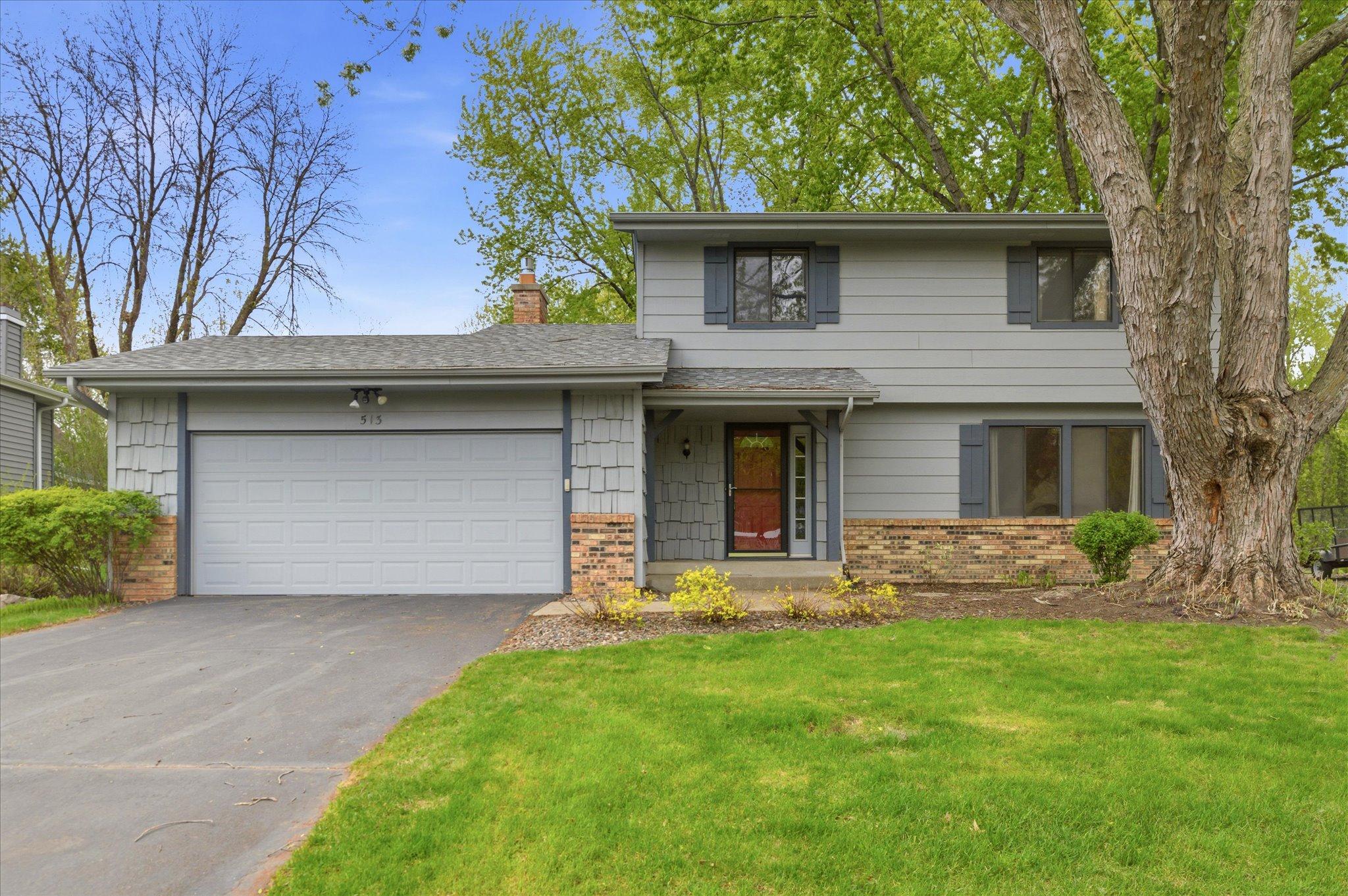 Welcome home to this charming two-story tucked on a peaceful cul-de-sac in sought-after Chanhassen.