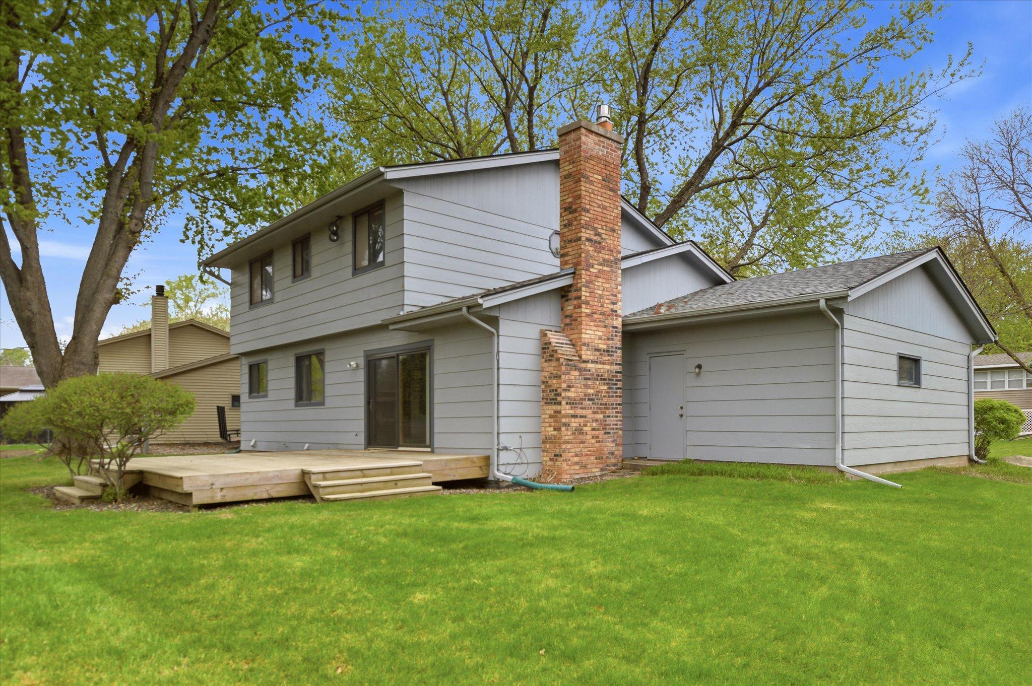 From this backyard perspective, you can truly appreciate the home’s spacious layout and inviting outdoor living areas.