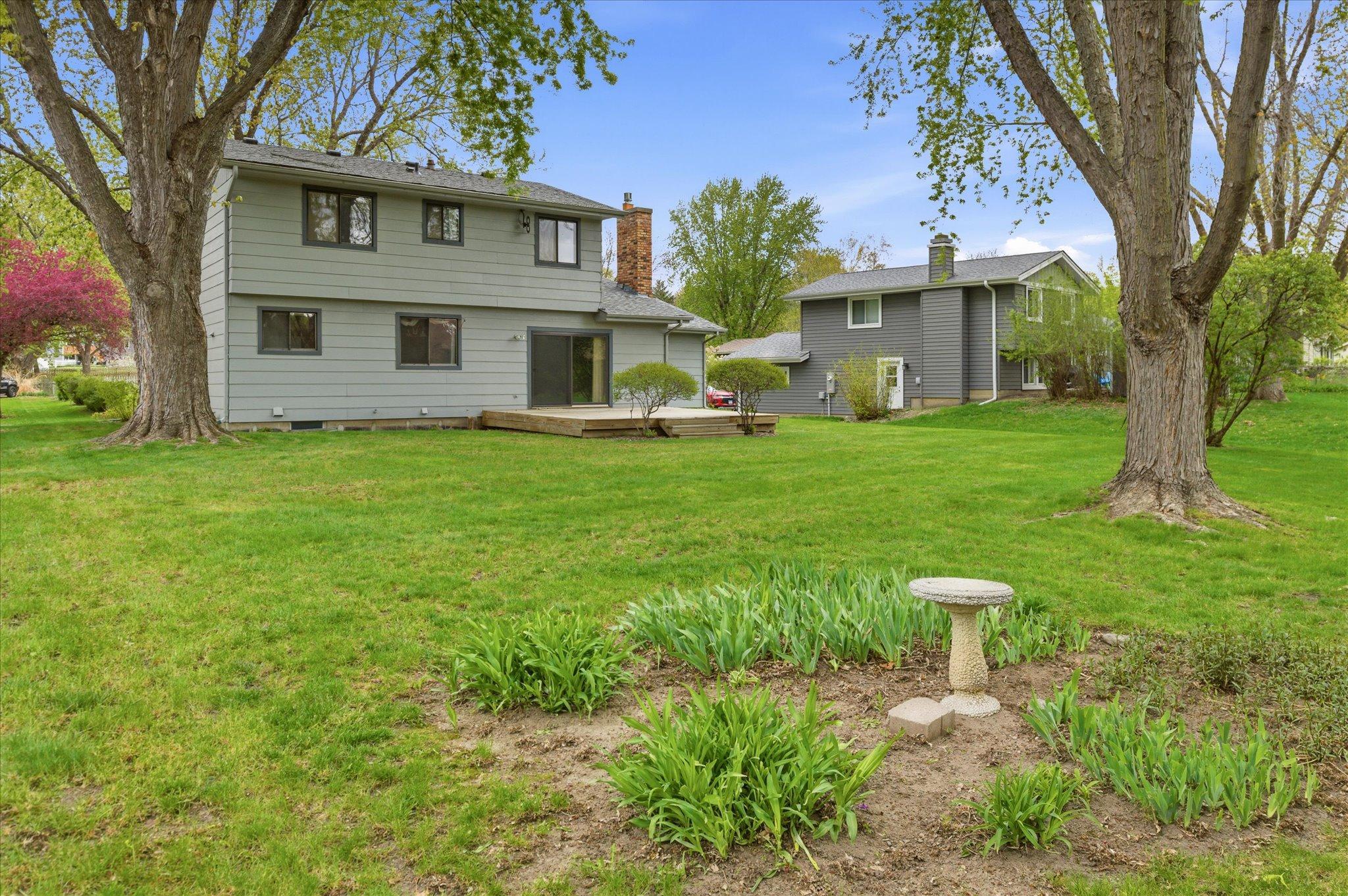 The spacious backyard offers endless possibilities for entertaining, lawn games, gardening, or creating your own outdoor retreat.