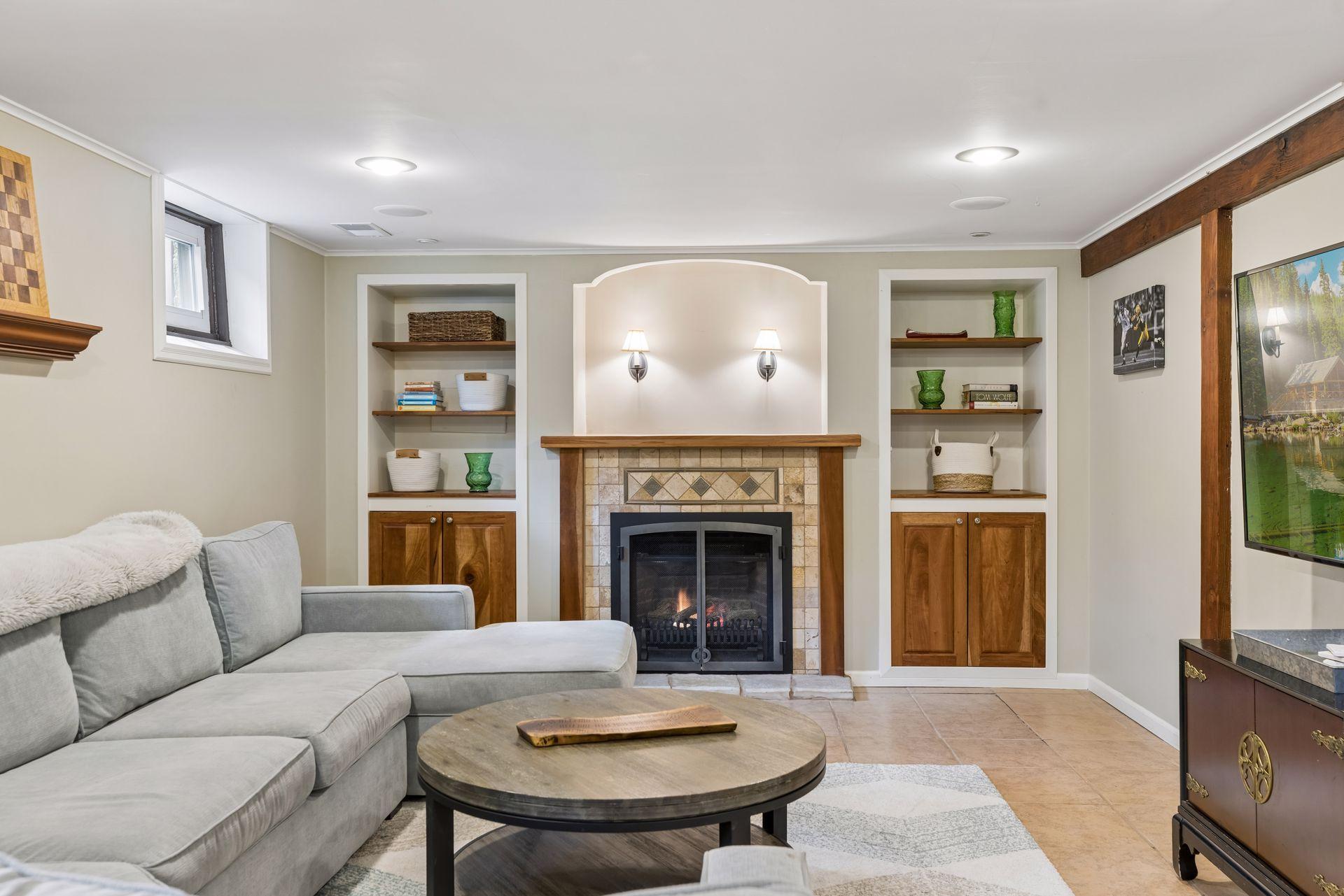 Lower level is fully finished with a cozy gas fireplace